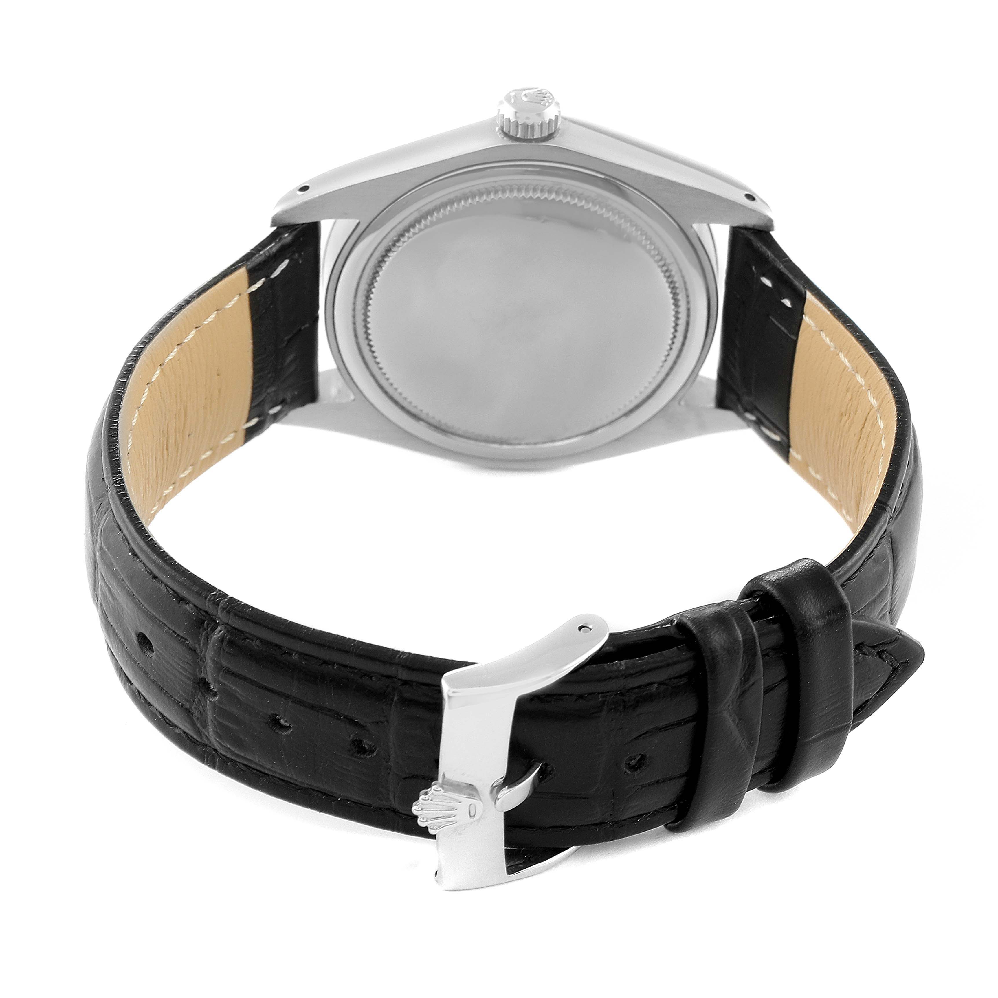 This image shows the back case and black leather strap of a Rolex Date 6694 Men's Stainless Steel Silver Dial 6694 Men's Stainless Steel Silver Dial model watch.