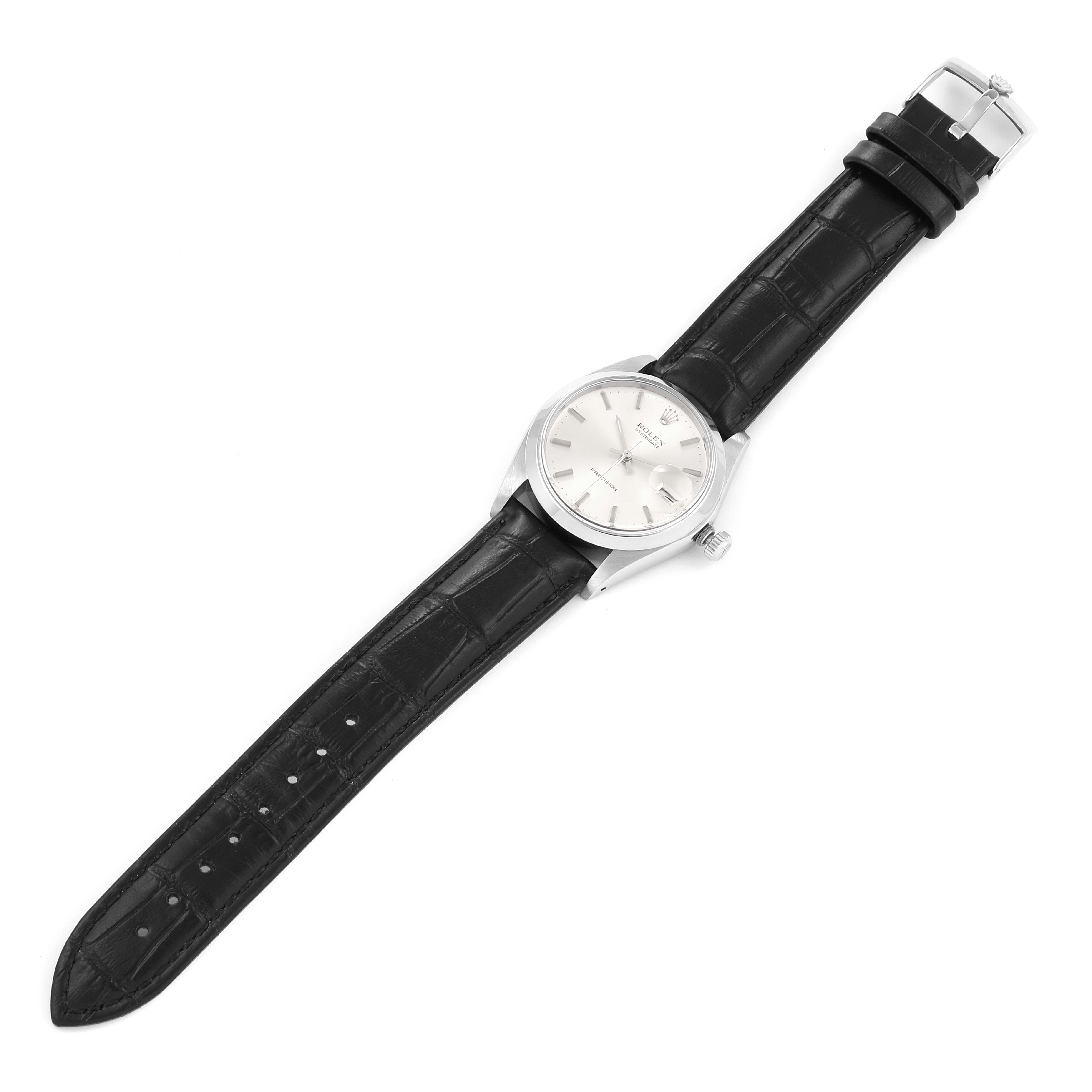 This is a top-down view of the Rolex Date 6694 Men's Stainless Steel Silver Dial 6694 Men's Stainless Steel Silver Dial model watch, showing the face, case, and black leather strap.