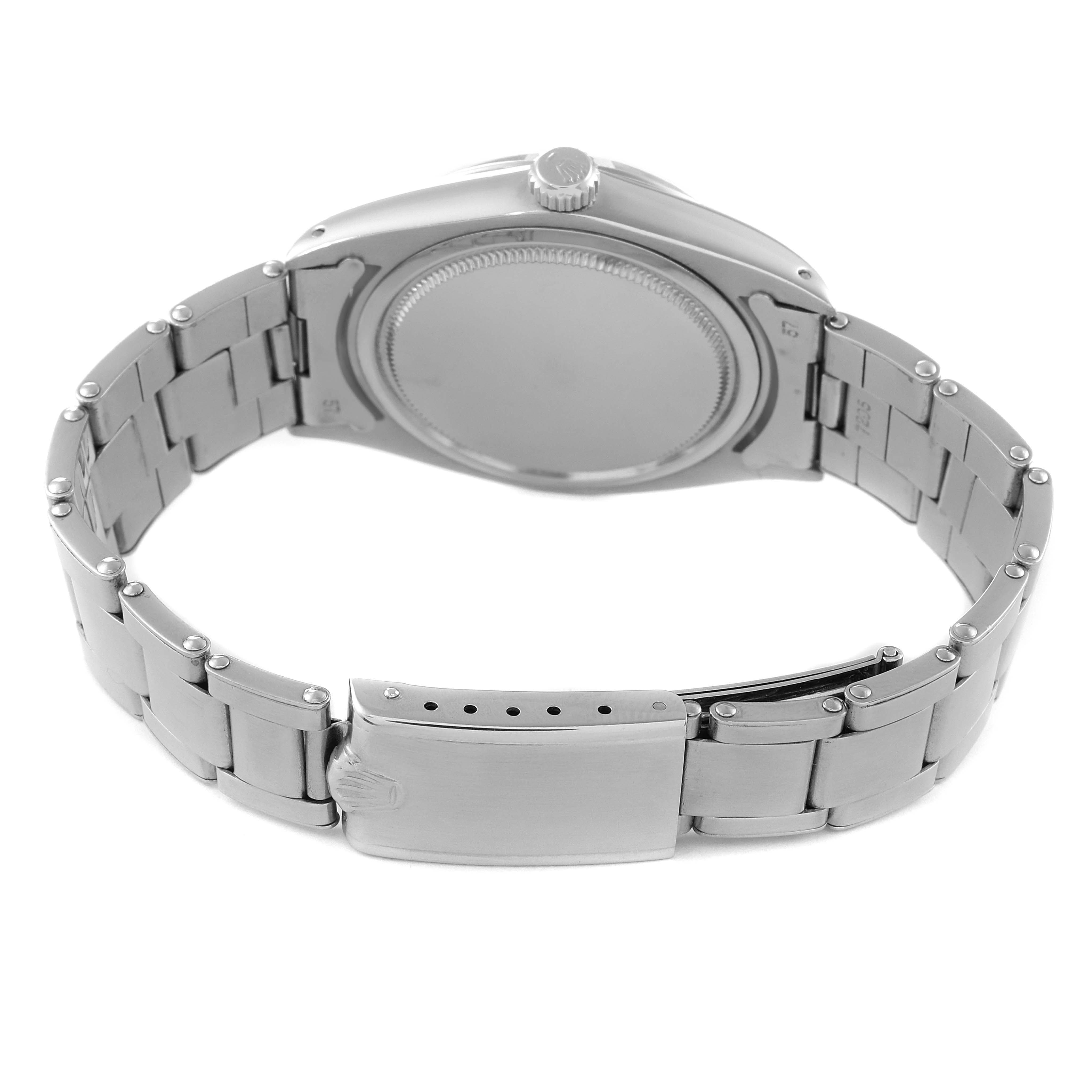 This image shows the back and clasp of a Rolex Vintage Collection 6694 Men's Stainless Steel Silver Dial 6694 Men's Stainless Steel Silver Dial model watch in a partially open position.