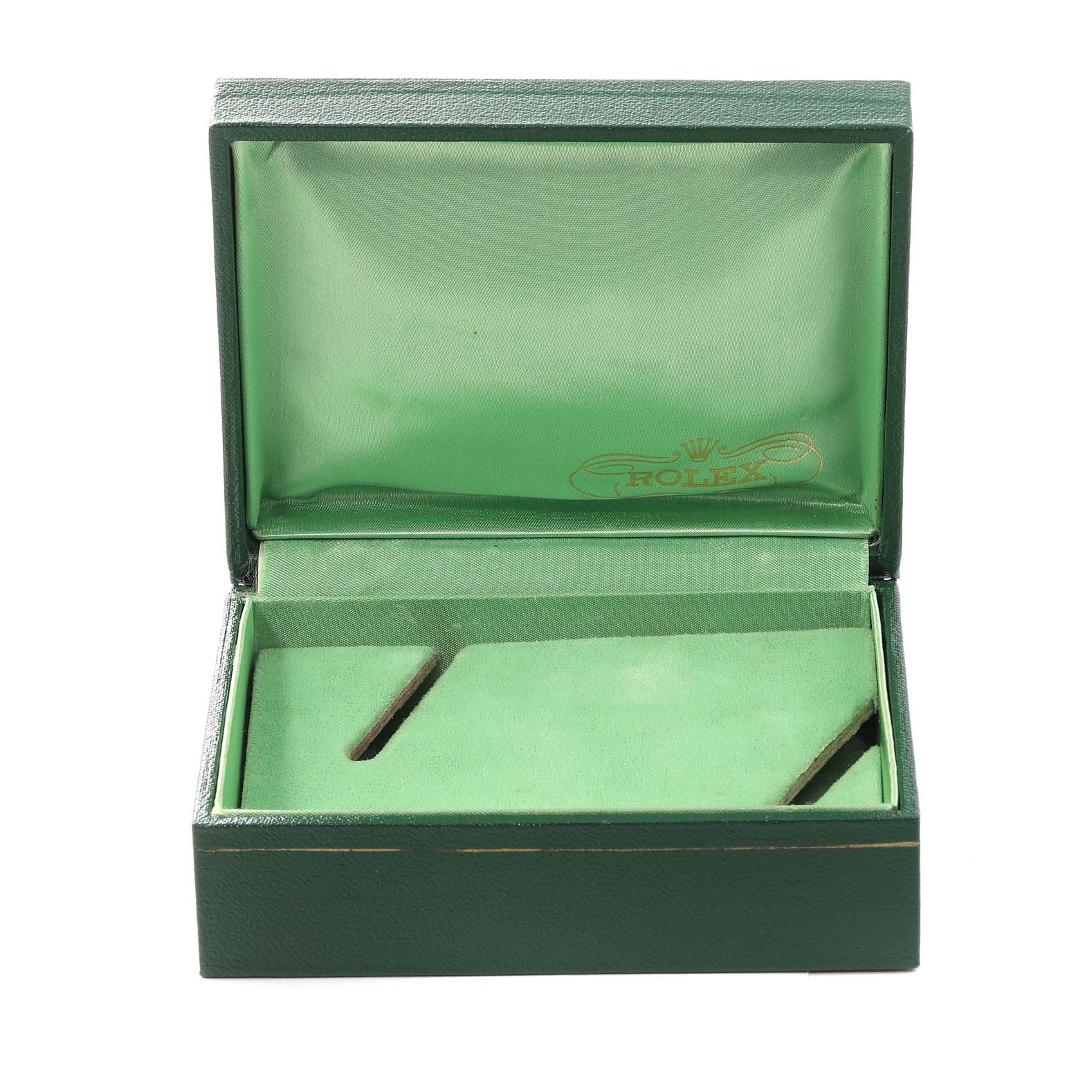 This image shows an open Rolex watch box for the Vintage Collection model, displaying its green interior and slots for watch storage.