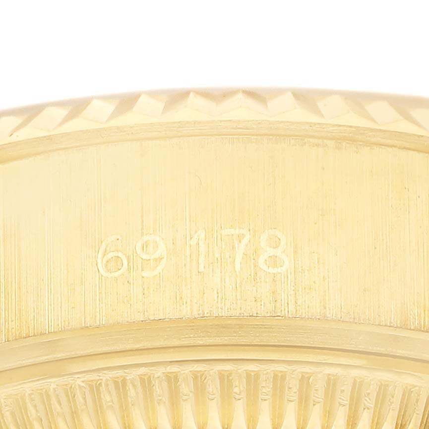 The image shows a close-up of the case side of a Rolex President 69178 Women's Yellow Gold Champagne Dial model, highlighting the model number engraving.