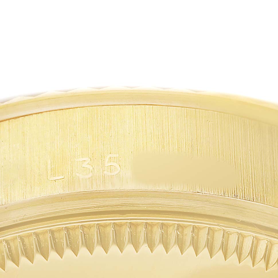 The close-up image shows the edge and side details of the bezel and case on a Rolex President 68278 Women's Yellow Gold Black Dial model watch.