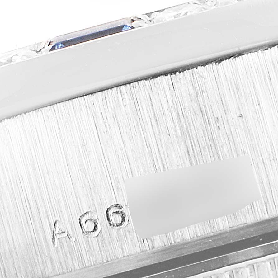 This close-up image shows part of the casing and serial number of a Rolex President 79089 Women's White Gold Silver Dial 79089 Women's White Gold Silver Dial model watch.