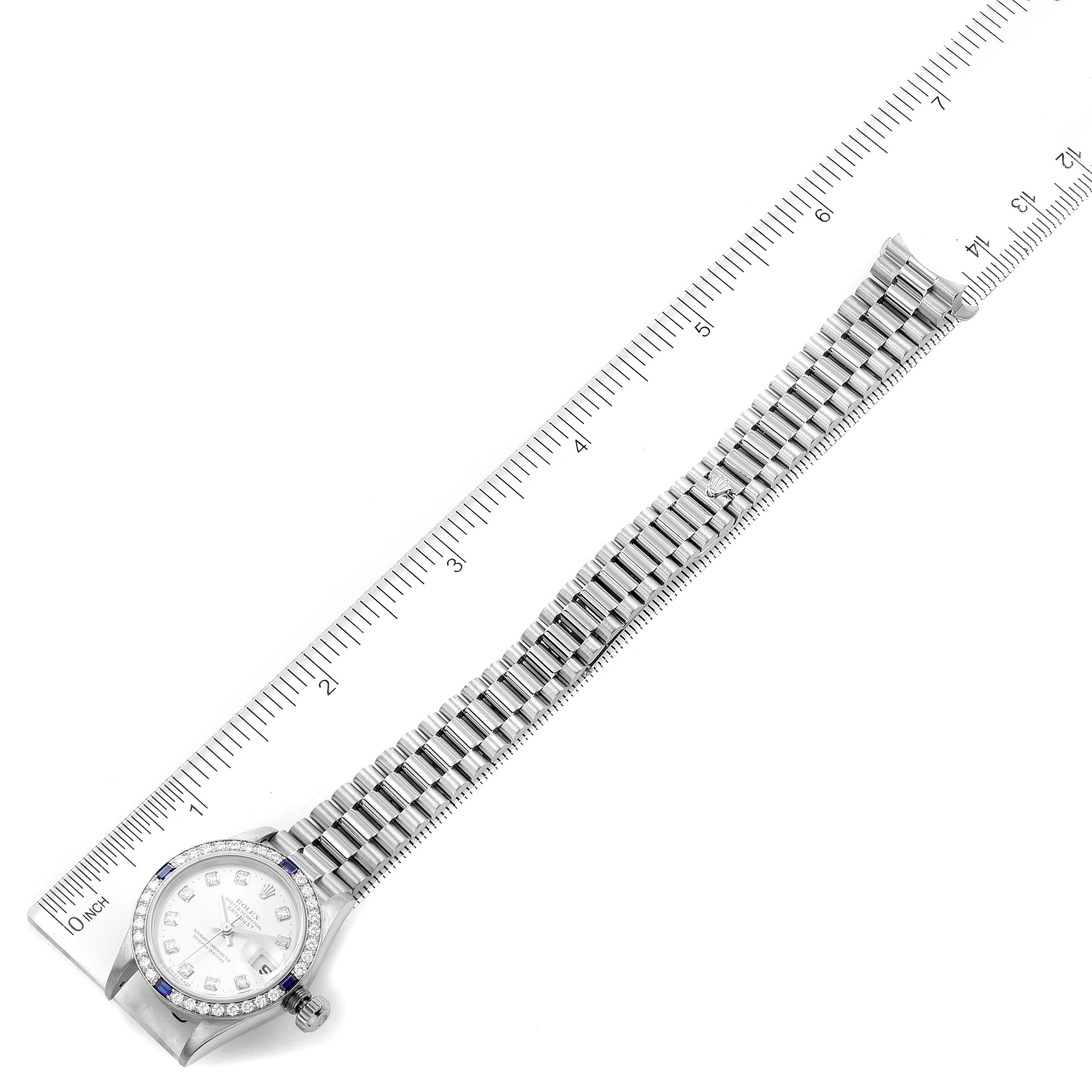 The image shows a Rolex President 79089 Women's White Gold Silver Dial 79089 Women's White Gold Silver Dial model watch, displaying the full length of the watch and bracelet, measured against a ruler.