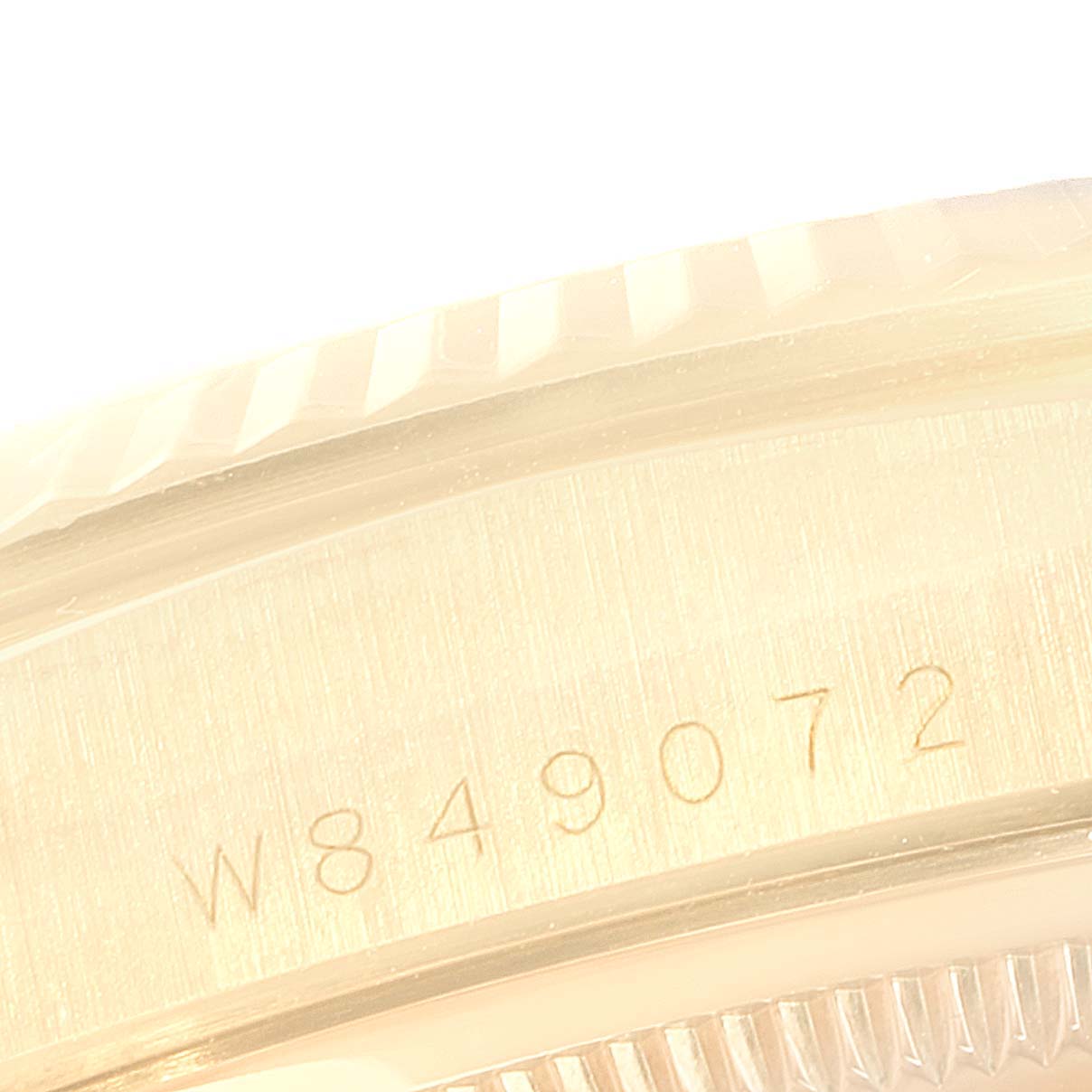 The image shows a close-up of the serial number engraved on the case of a Rolex President 18238 Men
s Yellow Gold Champagne Dial 18238 Men
s Yellow Gold Champagne Dial model watch.