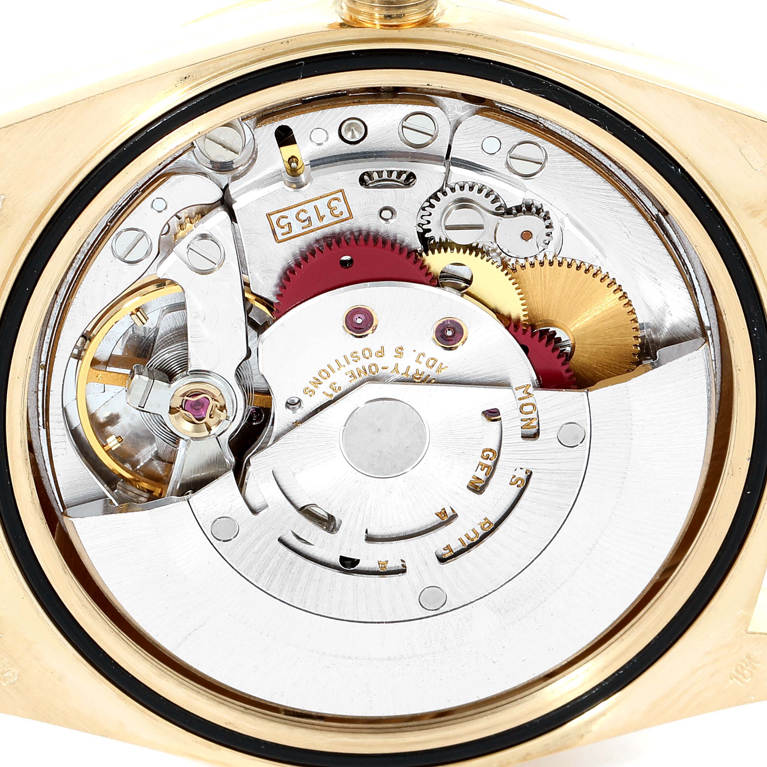This image shows the intricate inner mechanics of a Rolex President 18238 Men
s Yellow Gold Champagne Dial 18238 Men
s Yellow Gold Champagne Dial model watch, highlighting gears and movement parts.