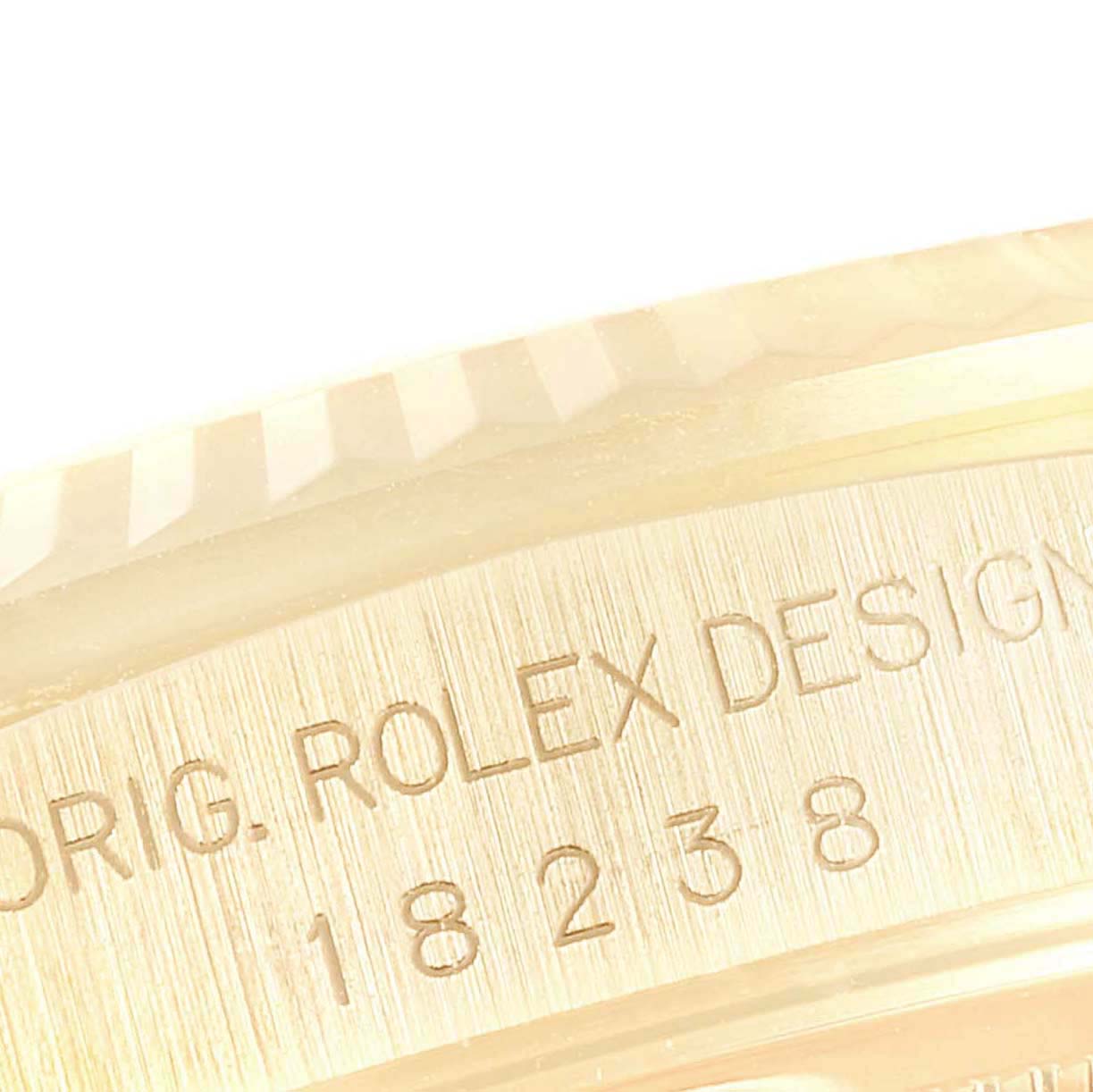 The image shows a close-up of the case engraving on a Rolex President 18238 Men
s Yellow Gold Champagne Dial 18238 Men
s Yellow Gold Champagne Dial model, highlighting its unique design number.