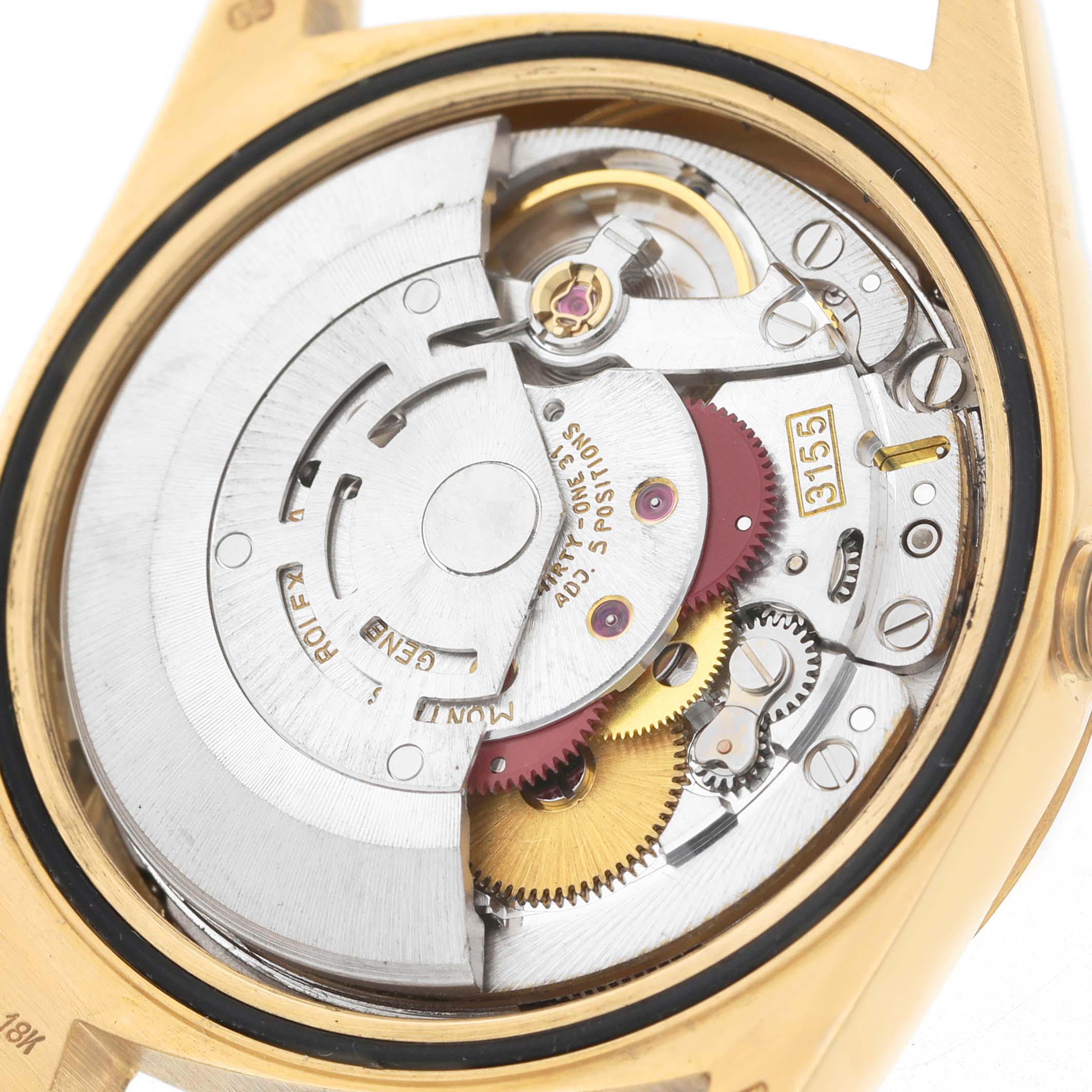 The image shows the movement and inner workings of a Rolex President 18238 Men's Yellow Gold Silver Dial model watch from a back angle.