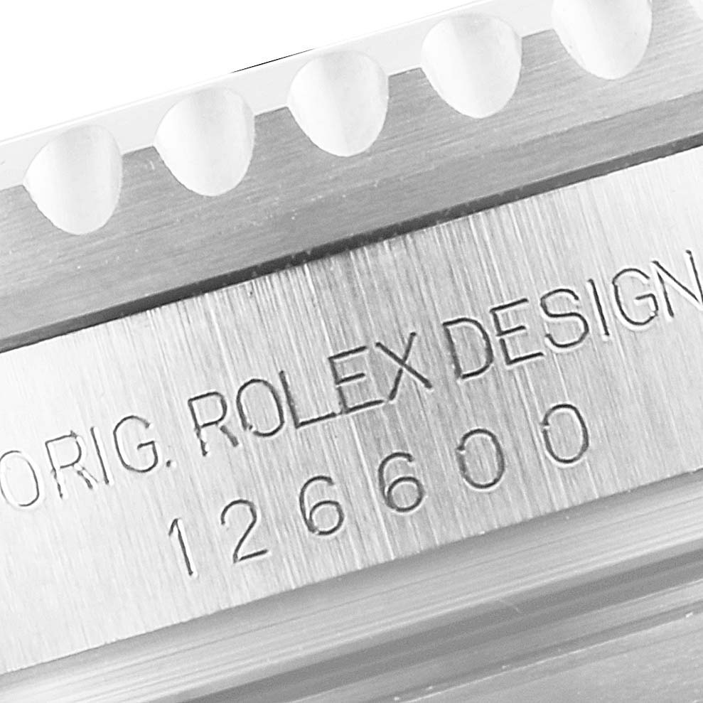 Close-up view of the side of a Rolex Sea-Dweller 126600 Men
s Stainless Steel Black Dial 126600 Men
s Stainless Steel Black Dial, showing the model number and part of the bezel.