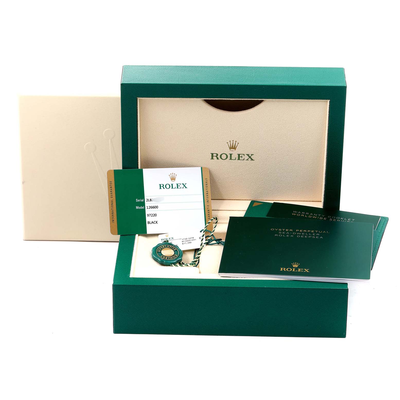 The image shows the packaging and accessories for the Rolex Sea-Dweller 126600 Men
s Stainless Steel Black Dial 126600 Men
s Stainless Steel Black Dial, including the warranty card, booklets, tags, and box.