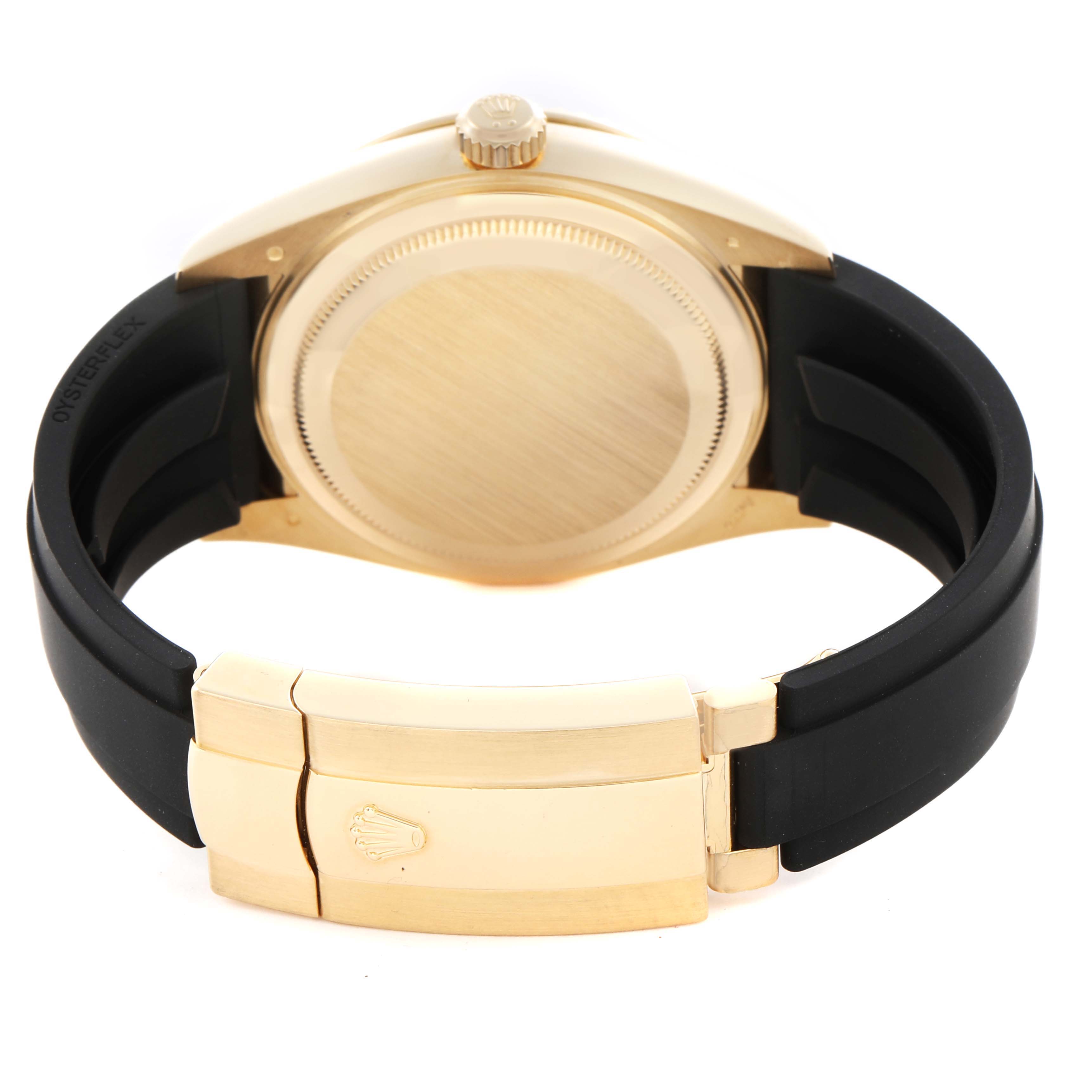 The image shows the back of a Rolex Sky-Dweller 326238 Men's Yellow Gold White Dial 326238 Men's Yellow Gold White Dial watch with its clasp and bracelet, focusing on the caseback and crown.