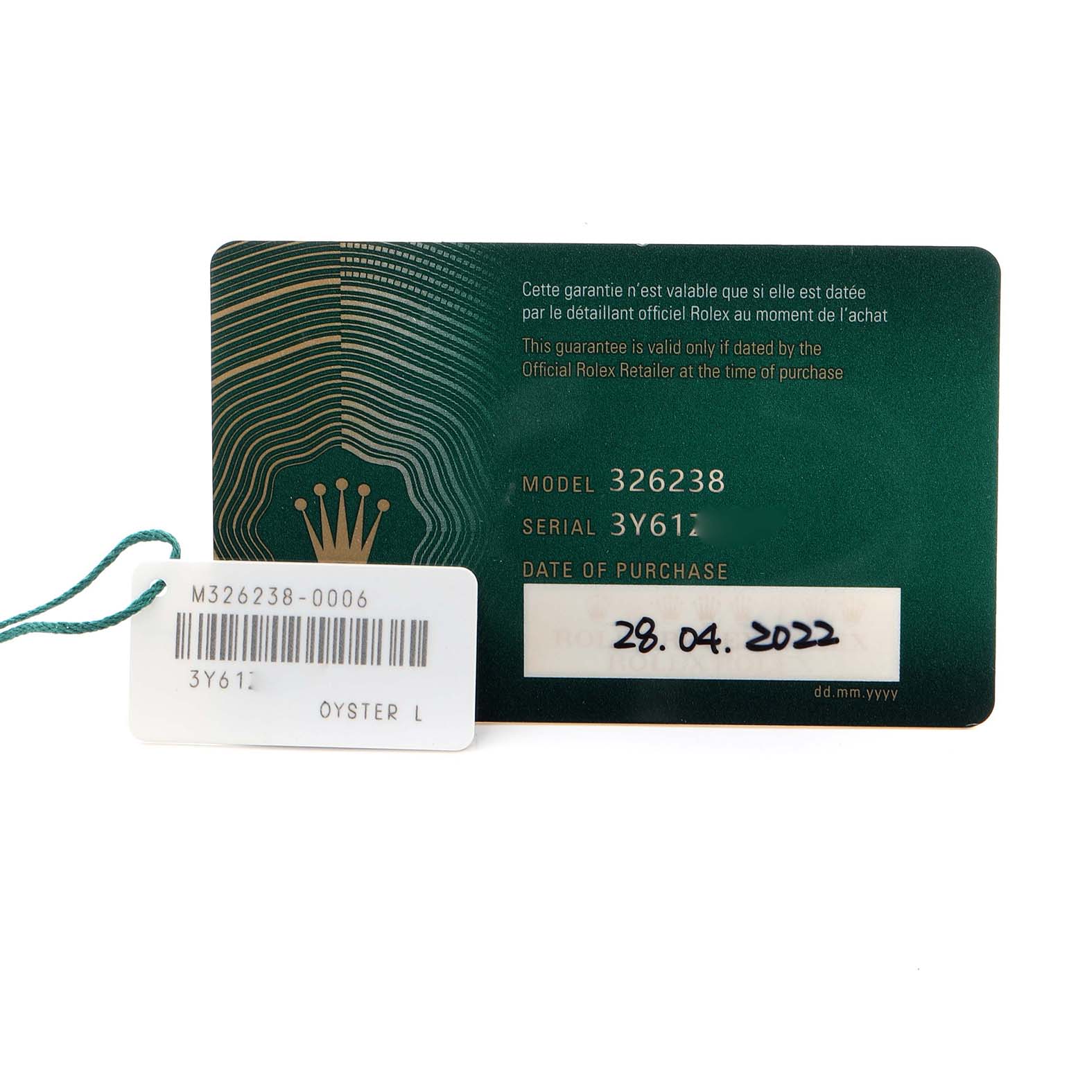 The image shows a warranty card and tag for the Rolex Sky-Dweller 326238 Men's Yellow Gold White Dial 326238 Men's Yellow Gold White Dial model viewed from above.