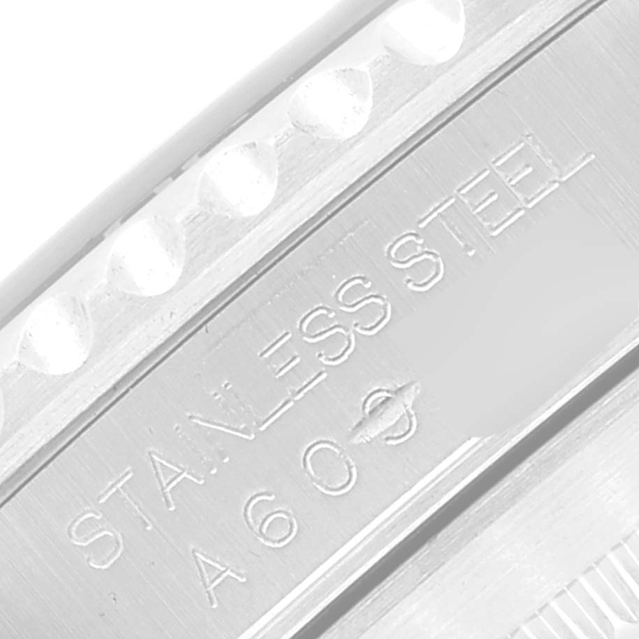 This close-up image shows the side of the bezel and the "Stainless Steel" engraving of the Rolex Submariner 14060 Men
s Stainless Steel Black Dial 14060 Men
s Stainless Steel Black Dial watch.