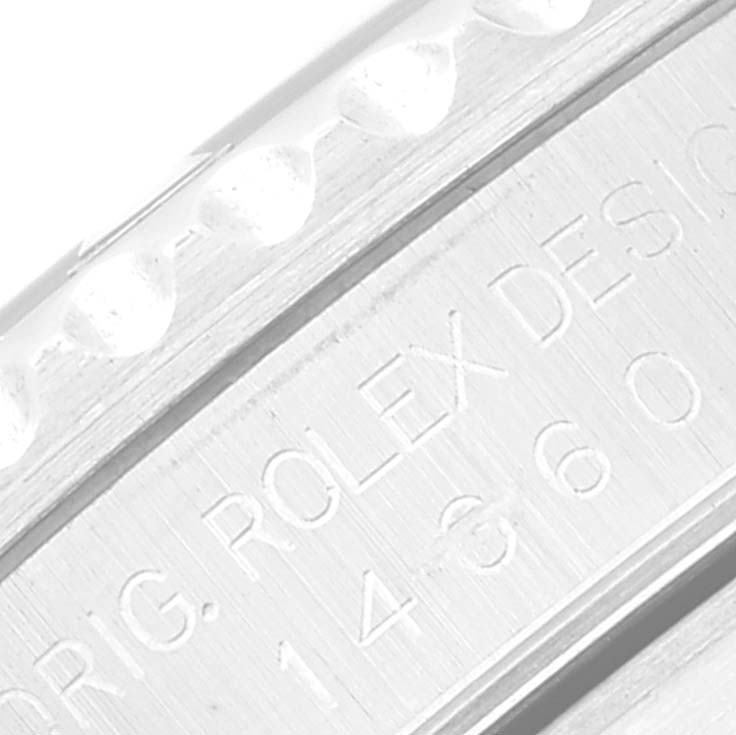 The image shows a close-up of the engraved side details of the Rolex Submariner 14060 Men
s Stainless Steel Black Dial 14060 Men
s Stainless Steel Black Dial, highlighting the model information.