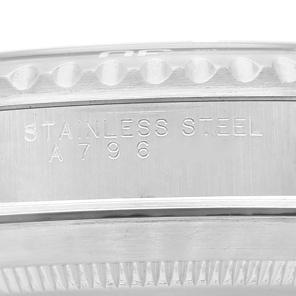The image shows a close-up of the side of the Rolex Submariner 14060 Men
s Stainless Steel Black Dial 14060 Men
s Stainless Steel Black Dial, highlighting the stainless steel inscription and part of the bezel.