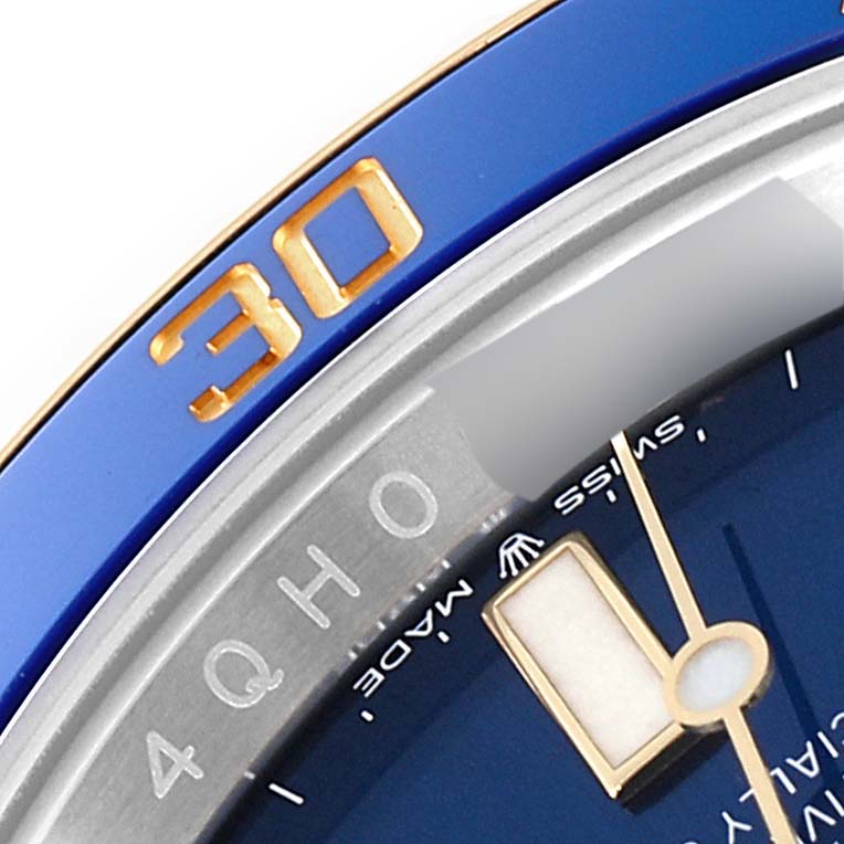 The image shows a close-up of the bezel and dial edge of a Rolex Submariner 126613 Men's Steel and Gold (two tone) Blue Dial 126613 Men's Steel and Gold (two tone) Blue Dial, focusing on the 30-minute marker and part of the watch face.