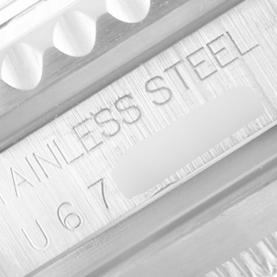 The image shows an extreme close-up of the side of a Rolex Submariner 16610 Men
s Stainless Steel Black Dial 16610 Men
s Stainless Steel Black Dial model, highlighting its stainless steel casing.