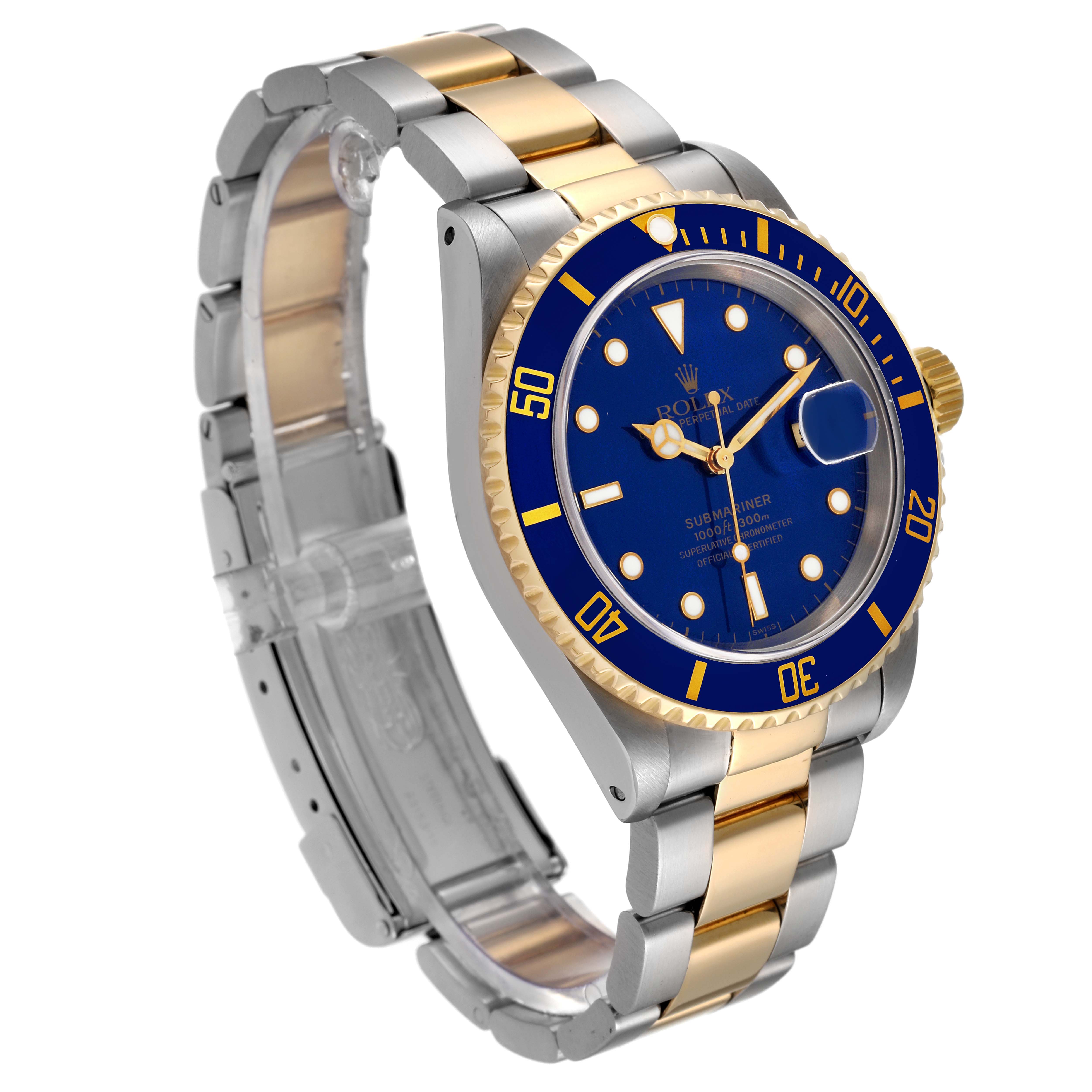 The image shows a Rolex Submariner 16613 Men's Steel and Gold (two tone) Blue Dial 16613 Men's Steel and Gold (two tone) Blue Dial watch at an angled front view, highlighting its blue dial, two-tone band, and bezel.