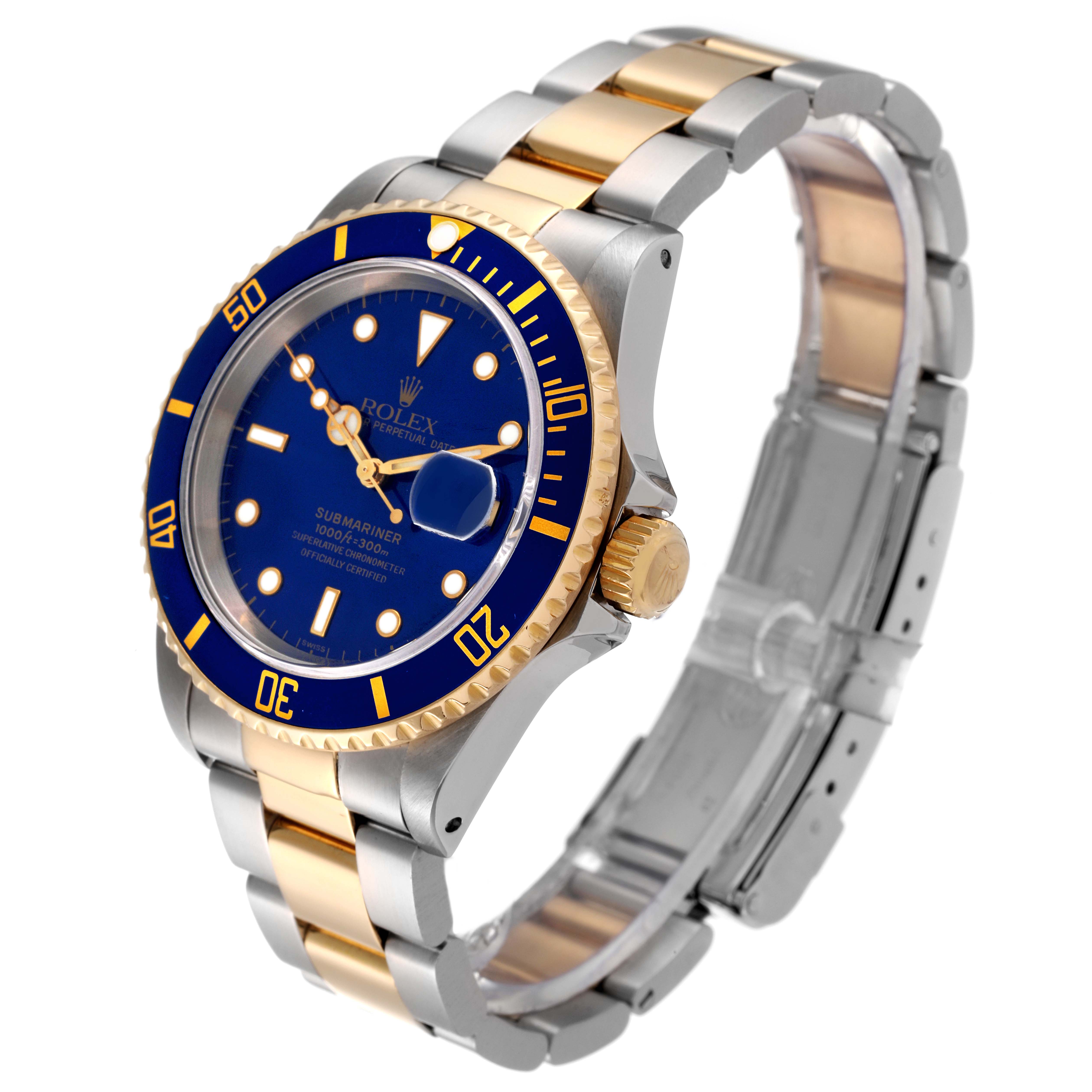 The image shows a side-angle view of the Rolex Submariner 16613 Men's Steel and Gold (two tone) Blue Dial 16613 Men's Steel and Gold (two tone) Blue Dial watch, highlighting its blue dial, two-tone bracelet, and bezel.