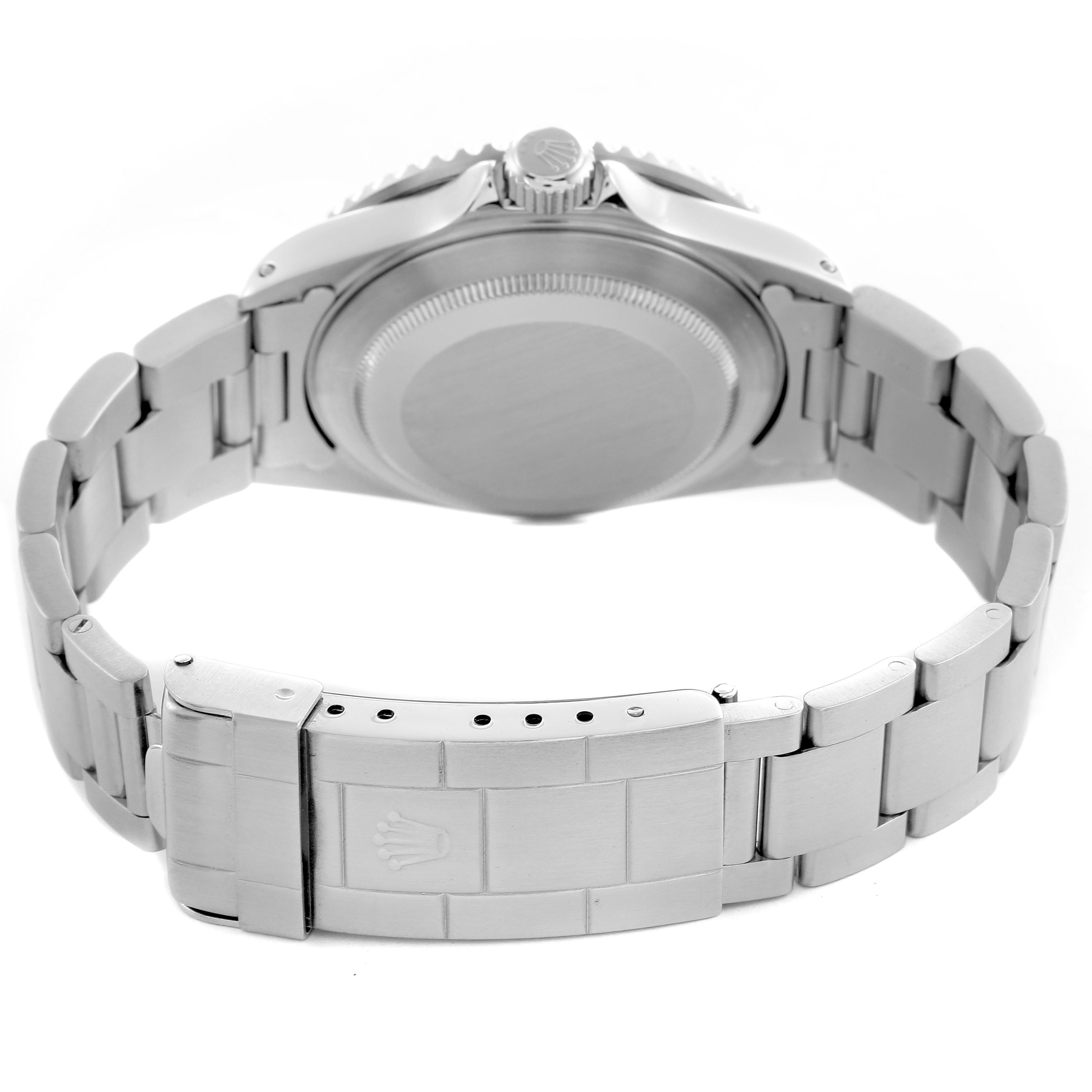 The image shows the back and clasp of a Rolex Submariner 16610 Men's Stainless Steel Black Dial 16610 Men's Stainless Steel Black Dial, highlighting the bracelet and crown.