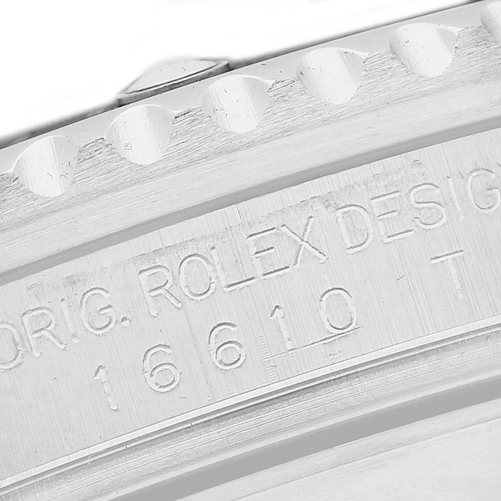 The image shows the side of a Rolex Submariner 16610 Men's Stainless Steel Black Dial, highlighting the engraved model number and design details on the case.