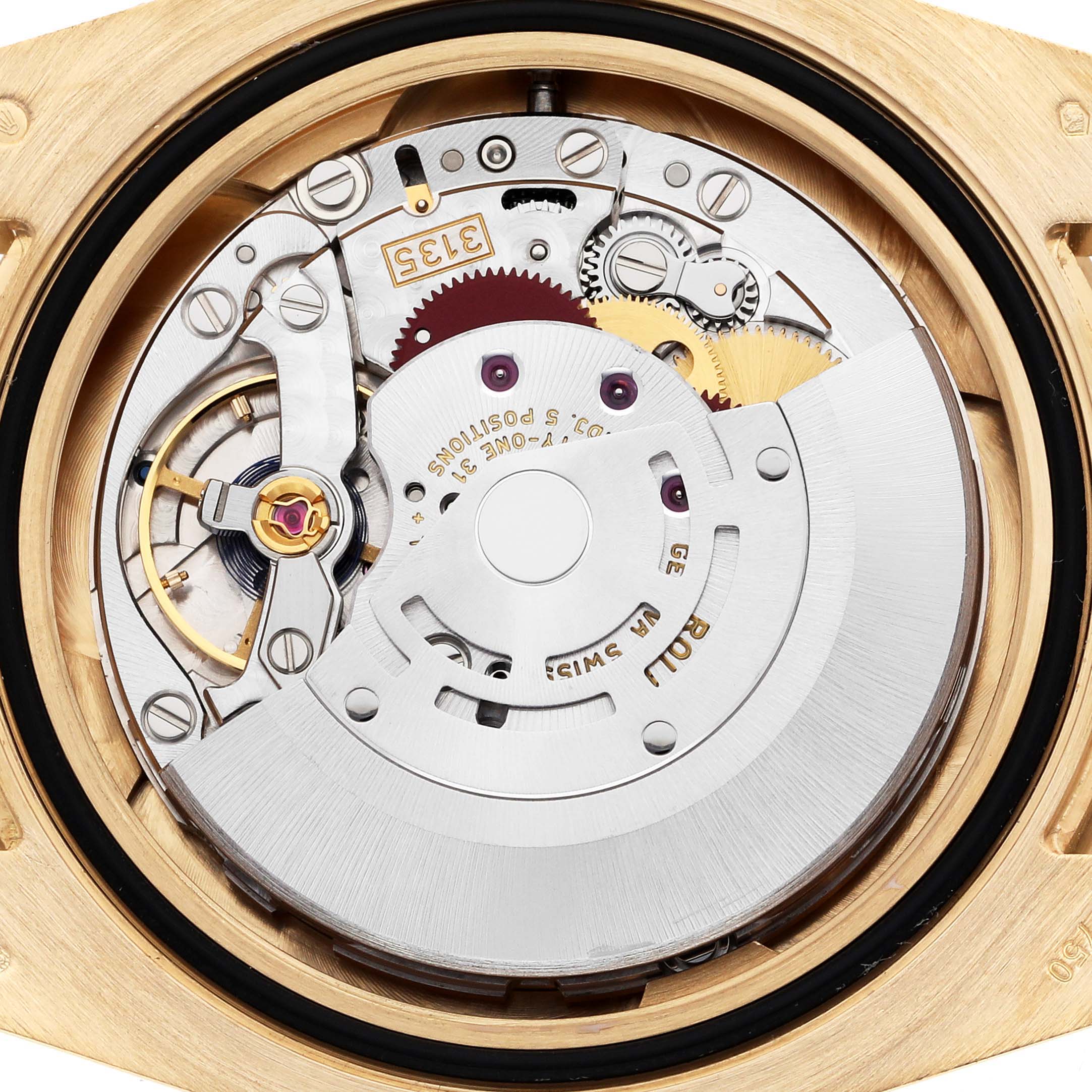 The image shows the movement of a Rolex Submariner 116618 Men's Yellow Gold Black Dial 116618 Men's Yellow Gold Black Dial viewed from the back, displaying gears and the rotor.