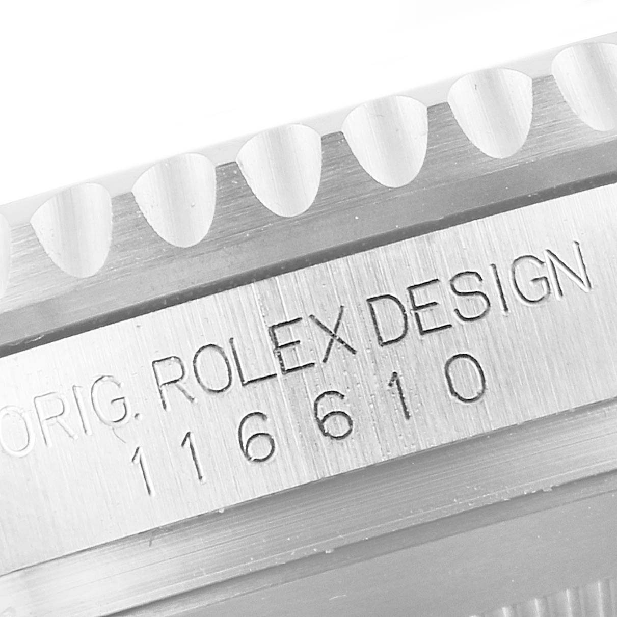 The image shows a close-up of the bezel and engraved side of a Rolex Submariner 116610LV Men
s Stainless Steel Green Dial 116610LV Men
s Stainless Steel Green Dial, model 116610.