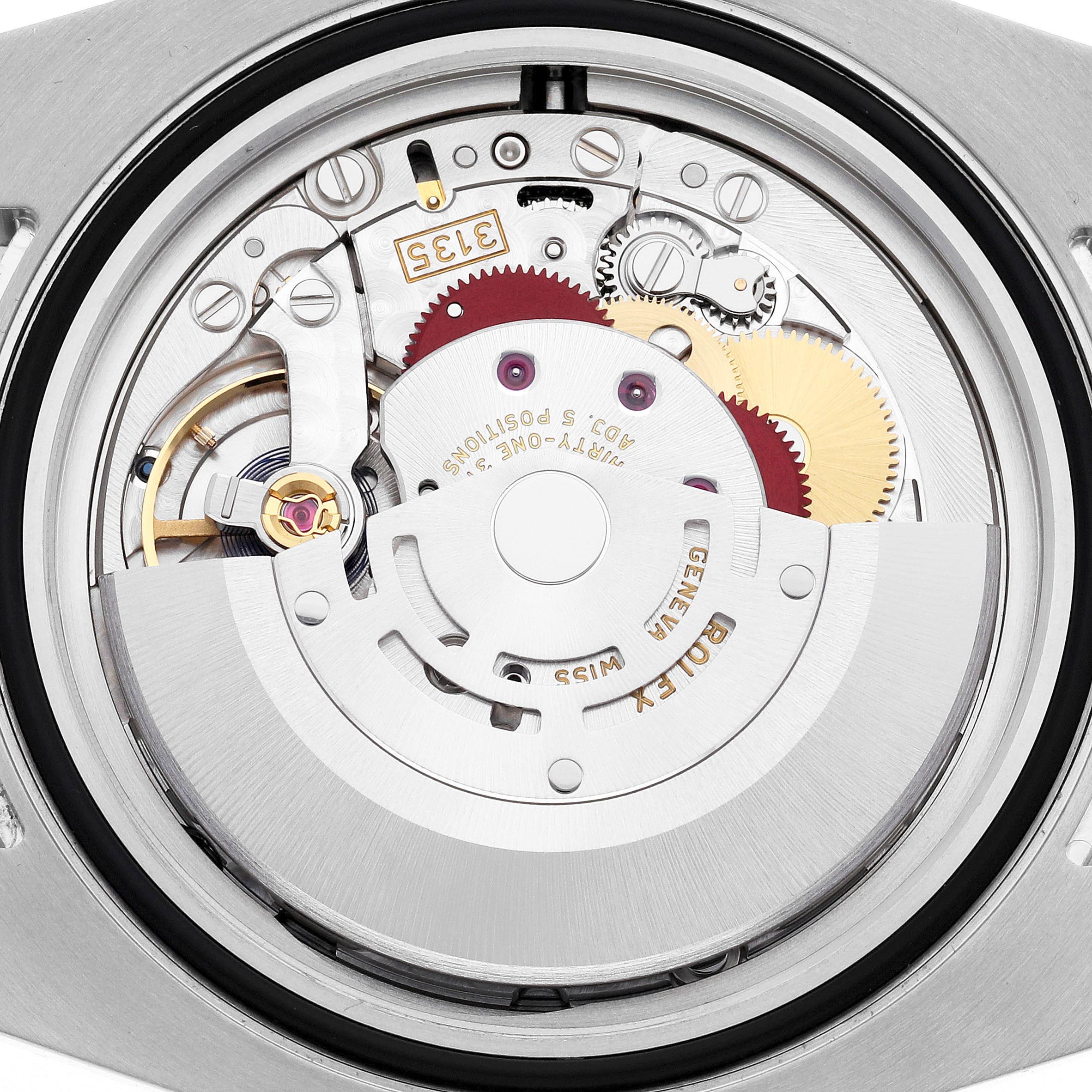 The image shows the movement mechanism of a Rolex Submariner 116610LV Men's Stainless Steel Green Dial 116610LV Men's Stainless Steel Green Dial, viewed from the back, highlighting gears and rotors.