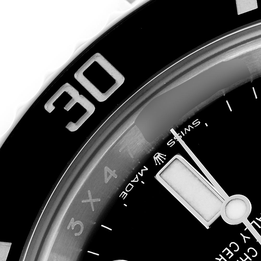 The image shows a close-up of the Rolex Submariner 124060 Men's Stainless Steel Black Dial 124060 Men's Stainless Steel Black Dial watch, focusing on the bezel, dial, and minute hand.