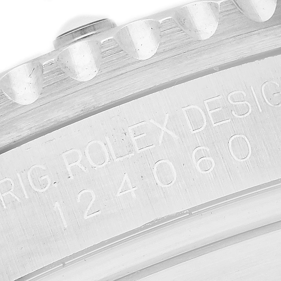 The image shows a close-up of the engraved side of a Rolex Submariner 124060 Men's Stainless Steel Black Dial 124060 Men's Stainless Steel Black Dial watch, highlighting part of the bezel and case.