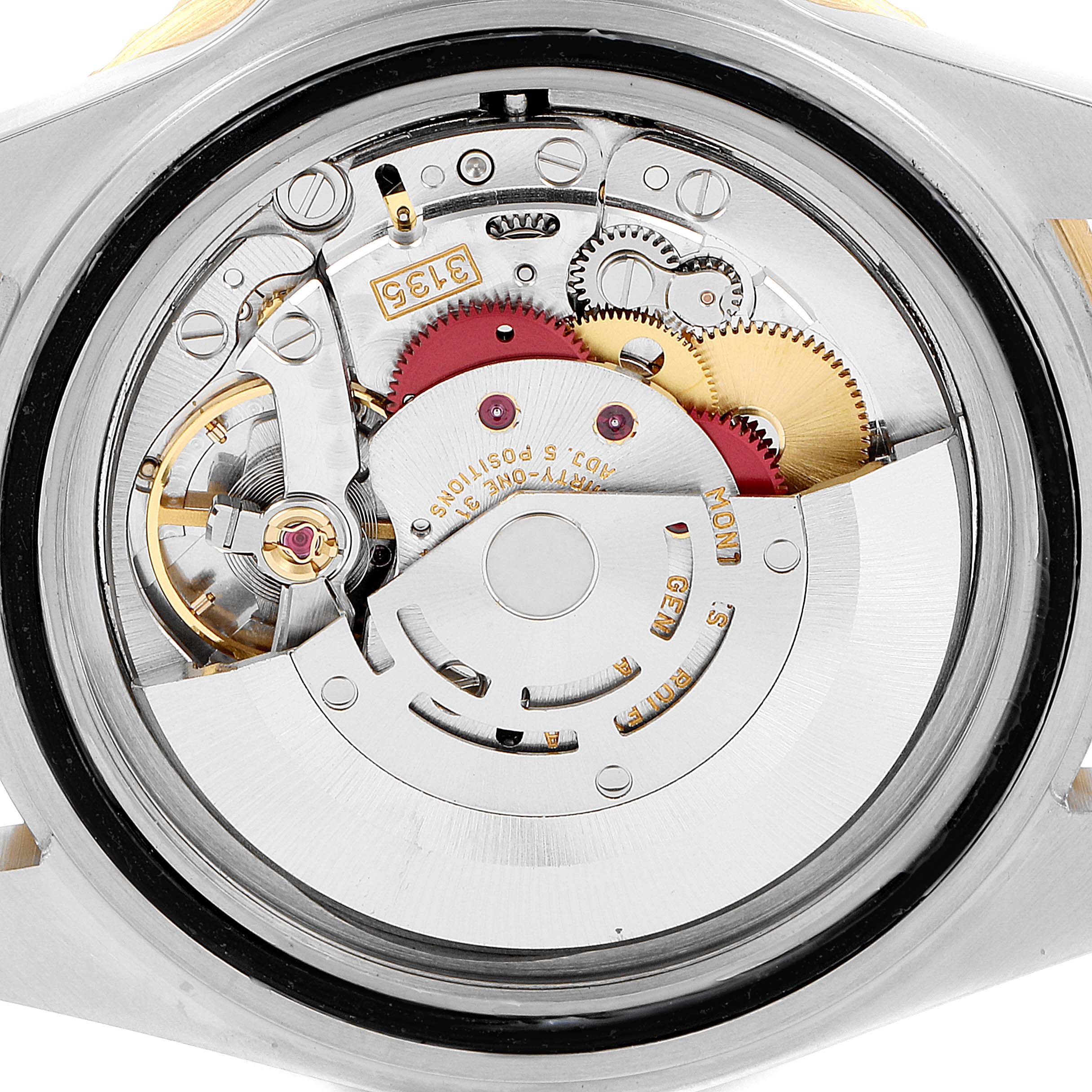 The image shows the intricate internal mechanism and components of a Rolex Submariner 16613 Men's Steel and Gold (two tone) Black Dial 16613 Men's Steel and Gold (two tone) Black Dial watch, viewed from the back.