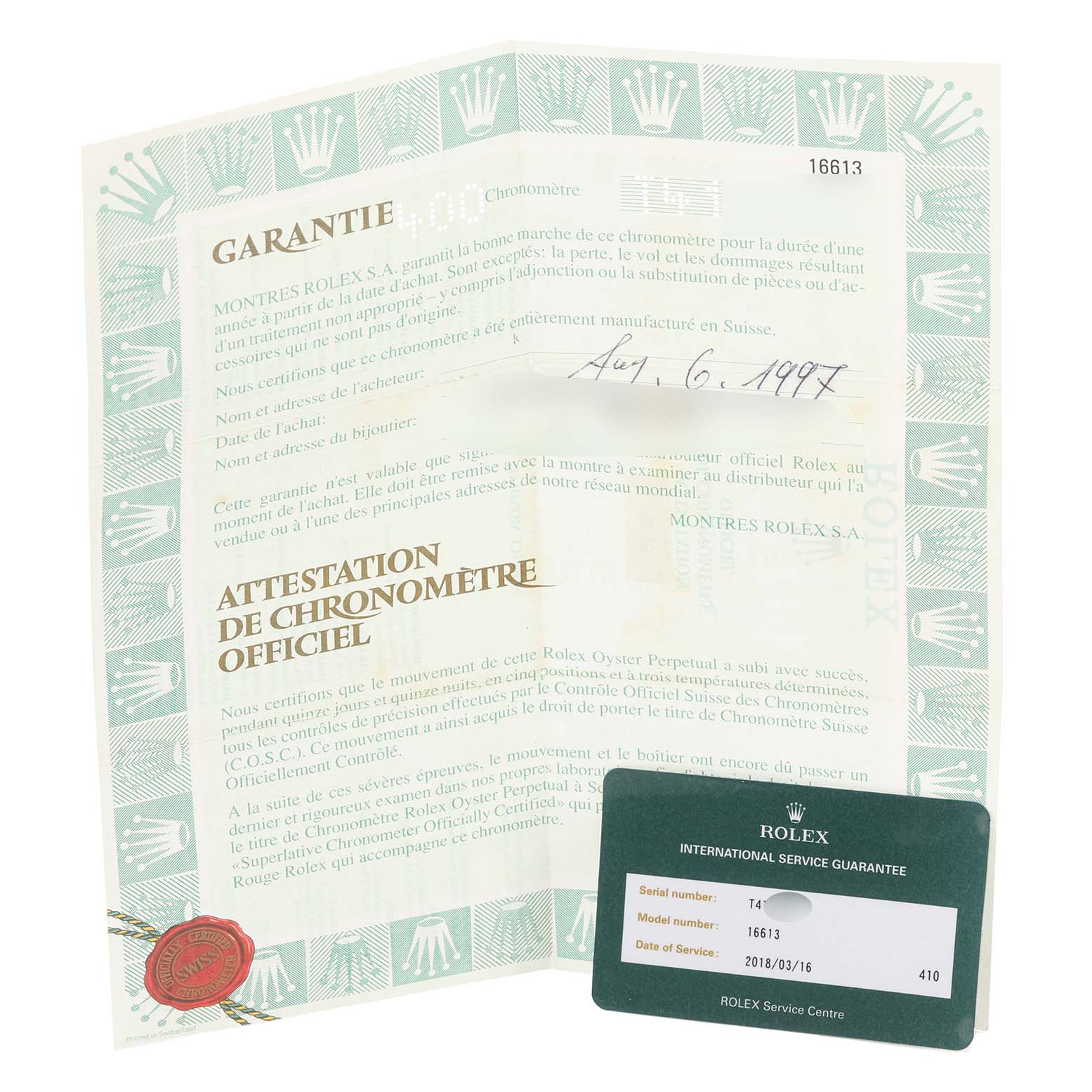 The image shows the warranty documents and international service guarantee card for a Rolex Submariner 16613 Men's Steel and Gold (two tone) Black Dial 16613 Men's Steel and Gold (two tone) Black Dial model.