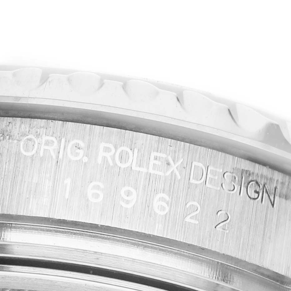 The image shows a close-up of the engraved edge of a Rolex Yacht-Master 169622 Women's Stainless Steel Silver Dial watch, focusing on the model number and bezel.