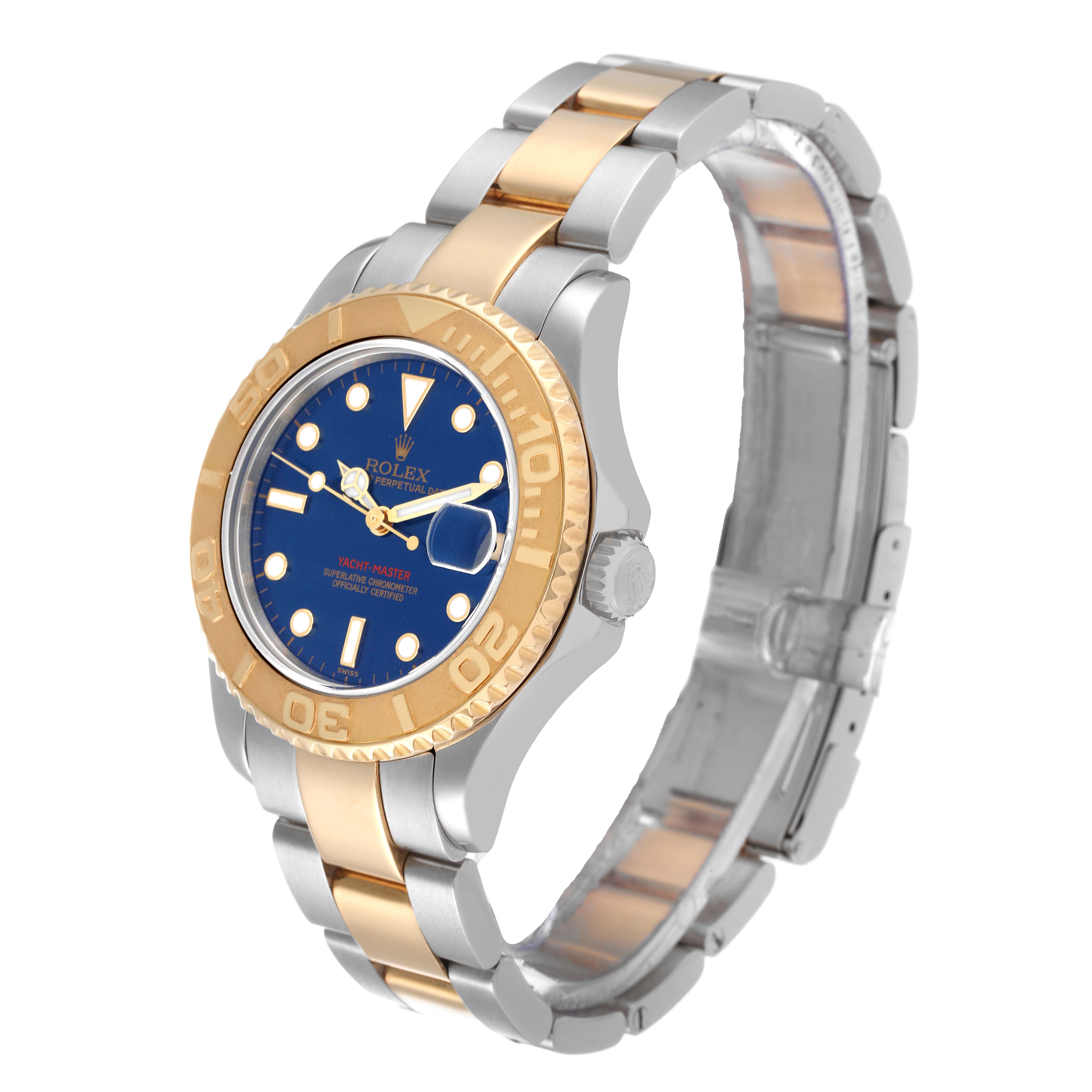 This Rolex Yacht-Master 68623 Men's Steel and Gold (two tone) Blue Dial 68623 Men's Steel and Gold (two tone) Blue Dial watch is shown at a slight angle, displaying its gold and silver bracelet, blue face, and gold bezel.