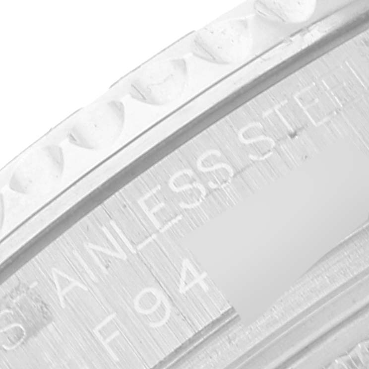 This close-up image shows part of the bezel and the engraved text on the side of the Yacht-Master by Rolex.