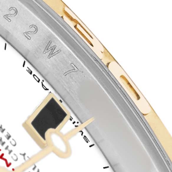The image shows a close-up of the bezel, part of the dial, and a hand of a Rolex Yacht-Master 16623 Men's Steel and Gold (two tone) White Dial watch.