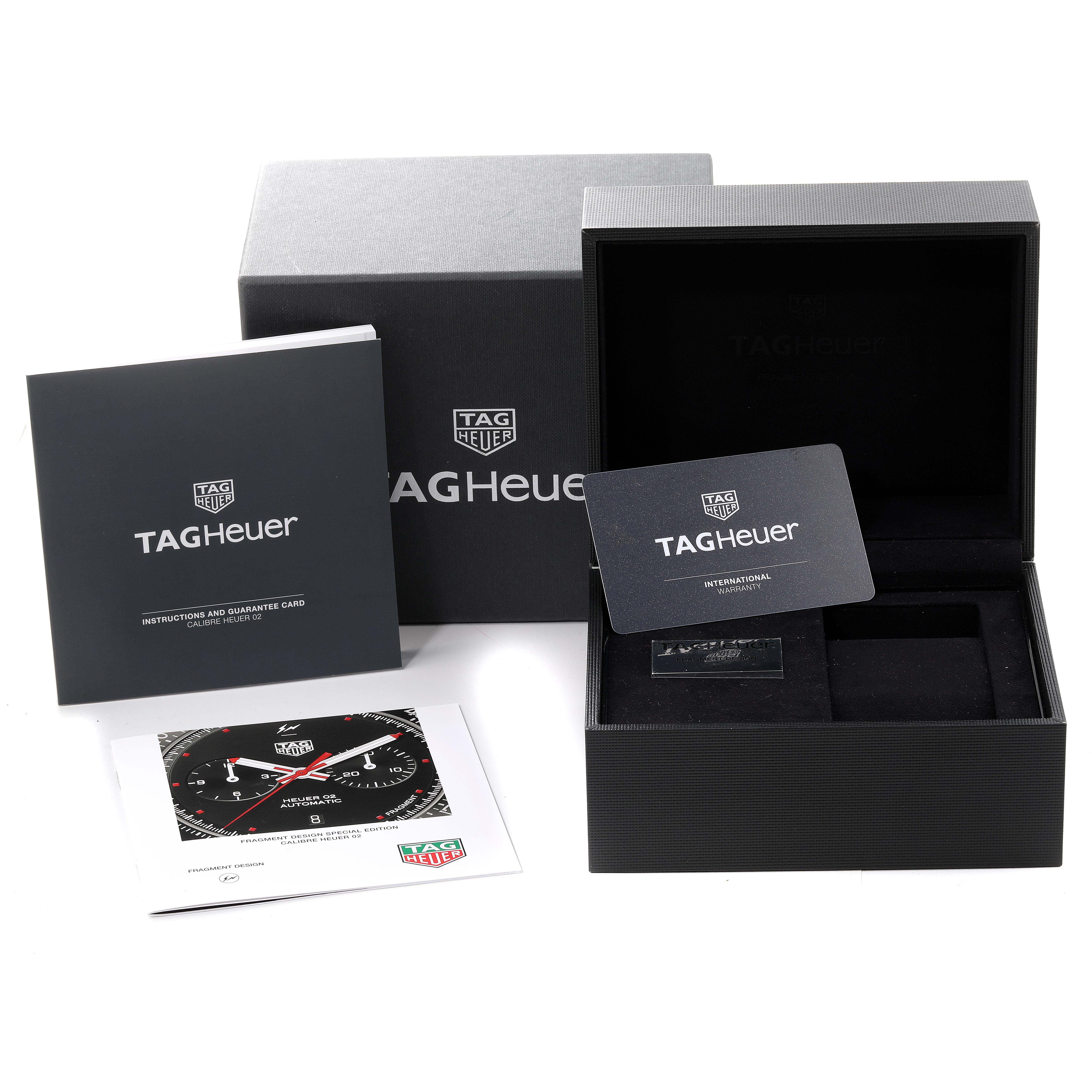 The image shows the packaging, international warranty card, instruction manual, and tag of a Tag Heuer Formula 1 CAZ201A.BA0641 Men's Stainless Steel Black Dial CAZ201A.BA0641 Men's Stainless Steel Black Dial watch.