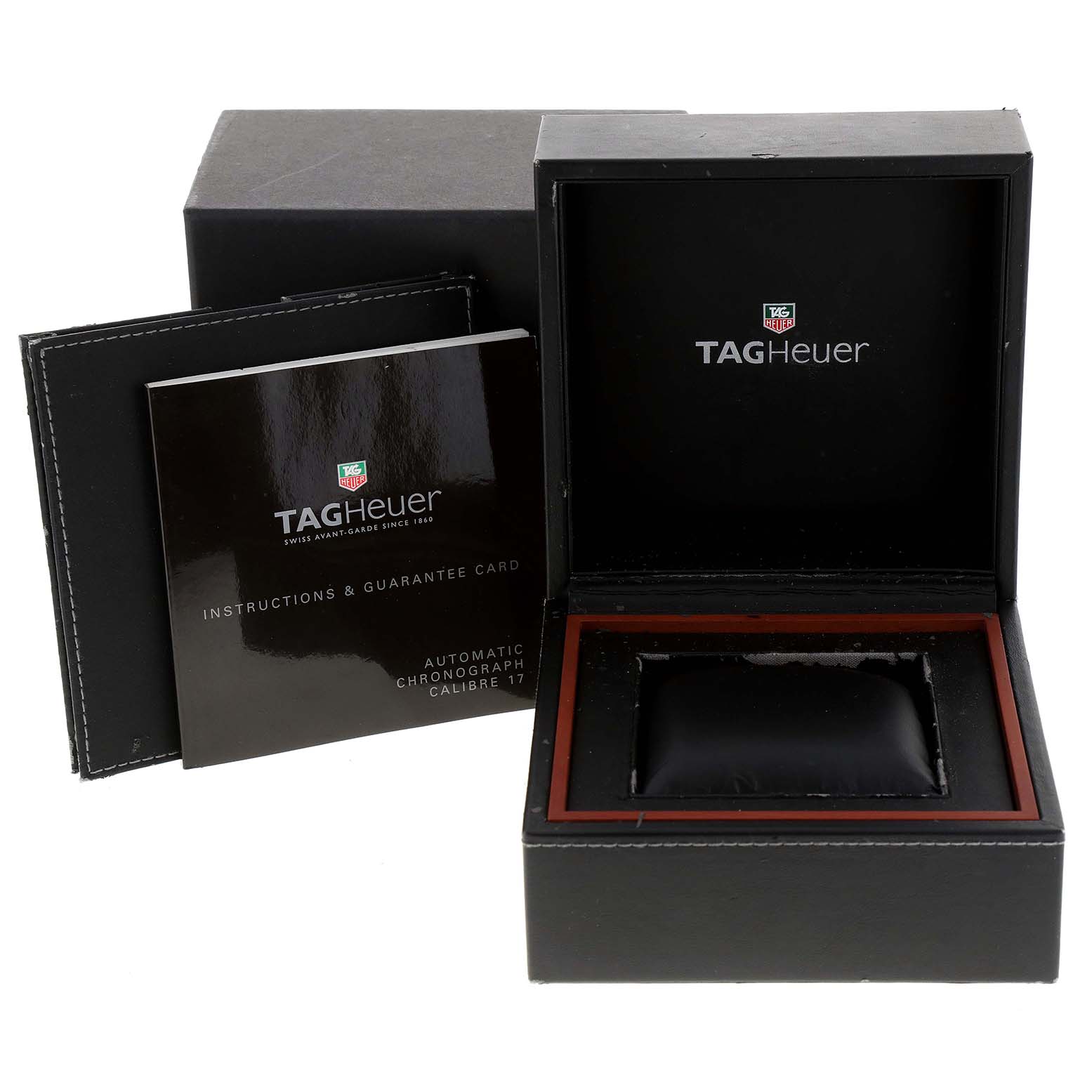 The image shows the open box, instruction manual, and guarantee card for the Monaco model by Tag Heuer.