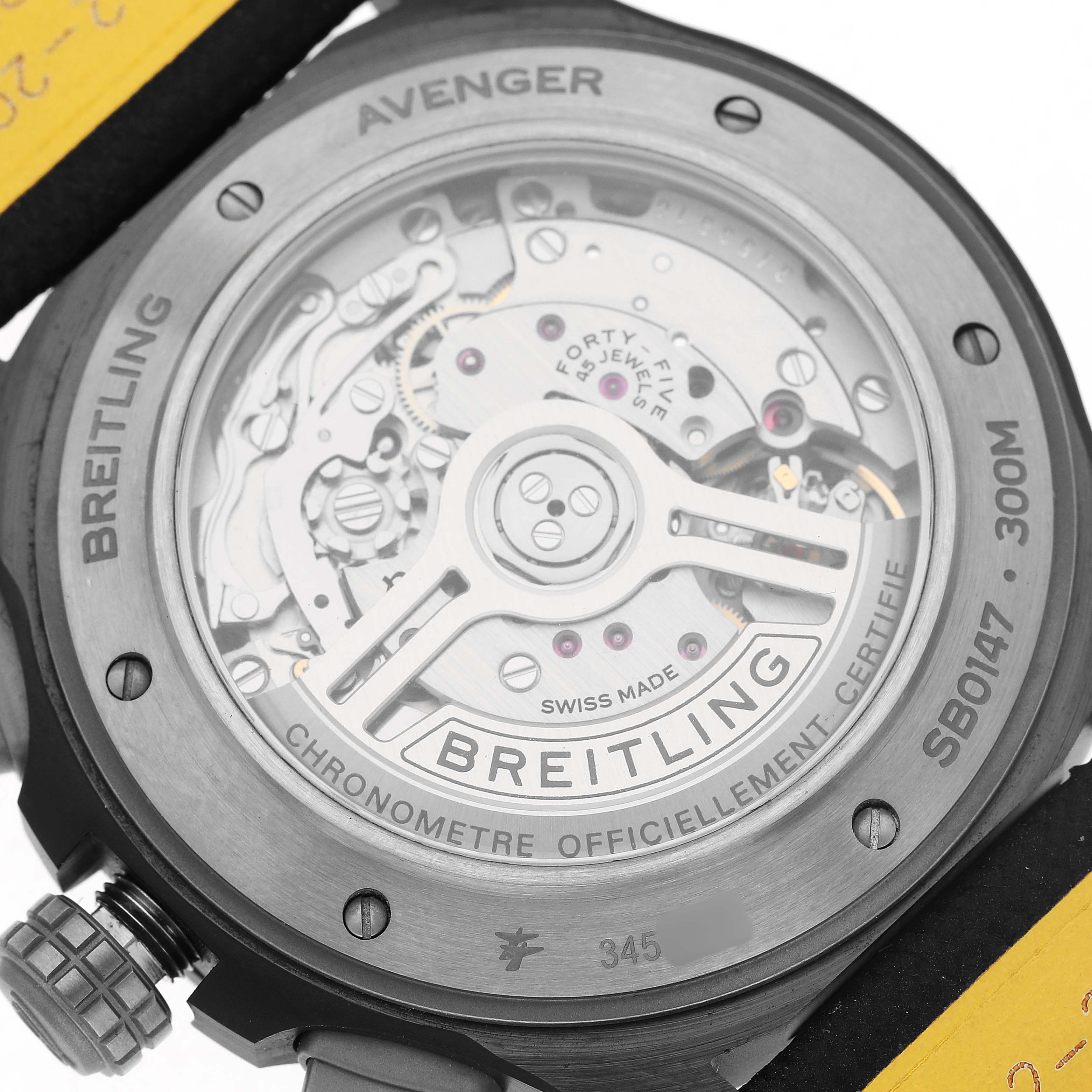 The image shows the caseback of the Breitling Avenger SB0147 Men's Ceramic Black Dial, displaying its mechanical movement and rotor through a transparent cover.