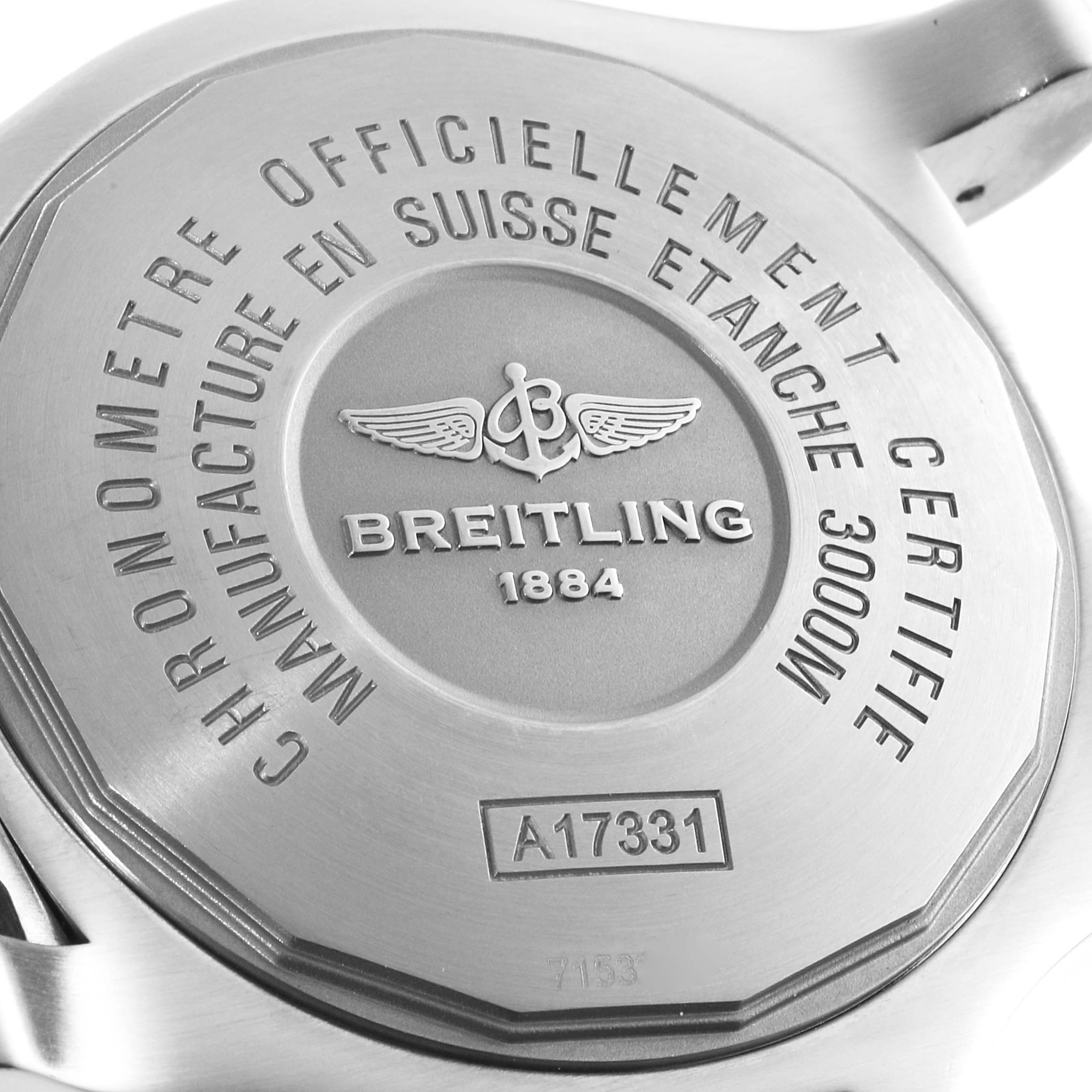 The image shows the back case of a Breitling Avenger A17331 Men's Stainless Steel Yellow Dial A17331 Men's Stainless Steel Yellow Dial watch, displaying inscriptions and the brand's logo.