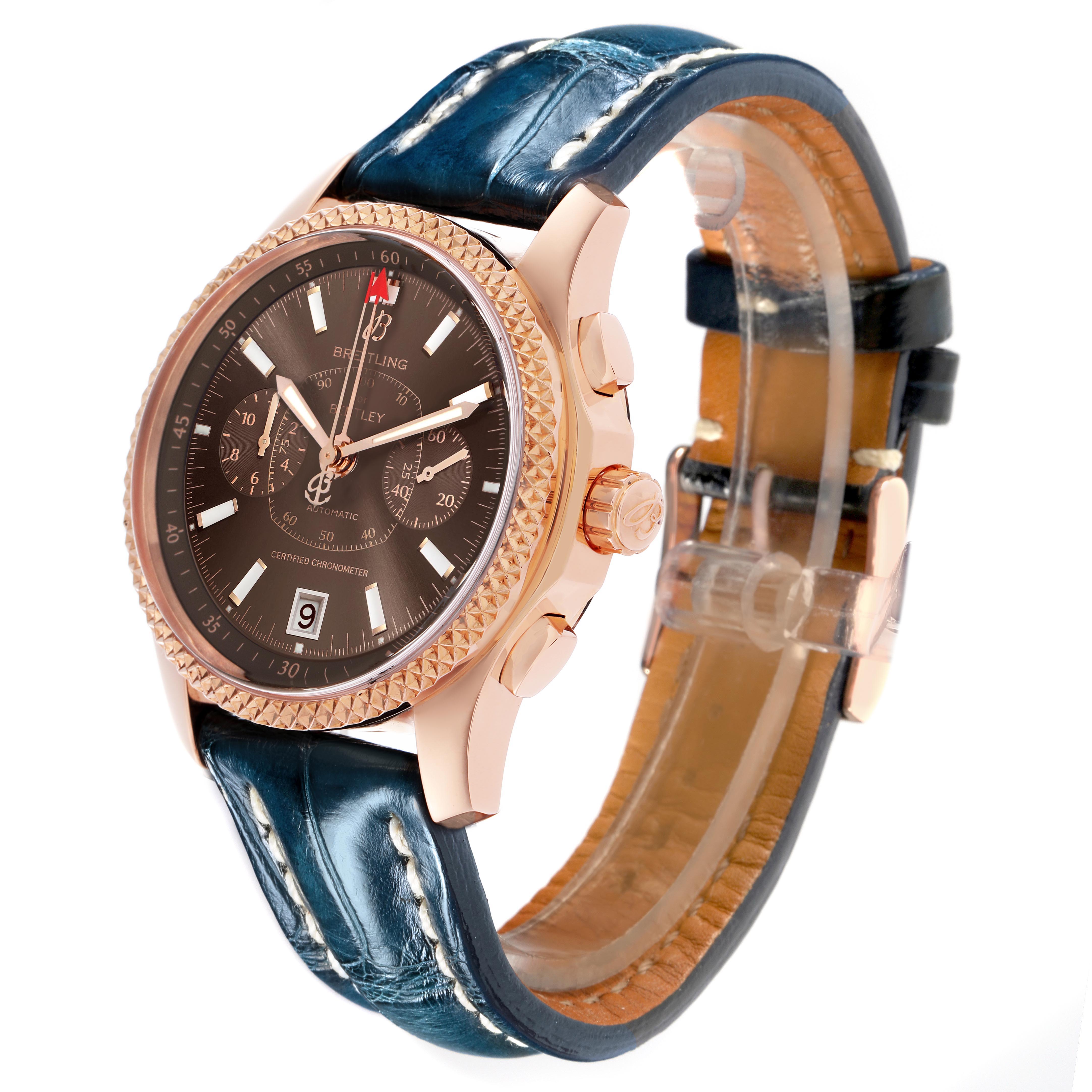 The Bentley by Breitling watch is shown at a slight angle, highlighting the rose gold case, textured bezel, and blue leather strap.