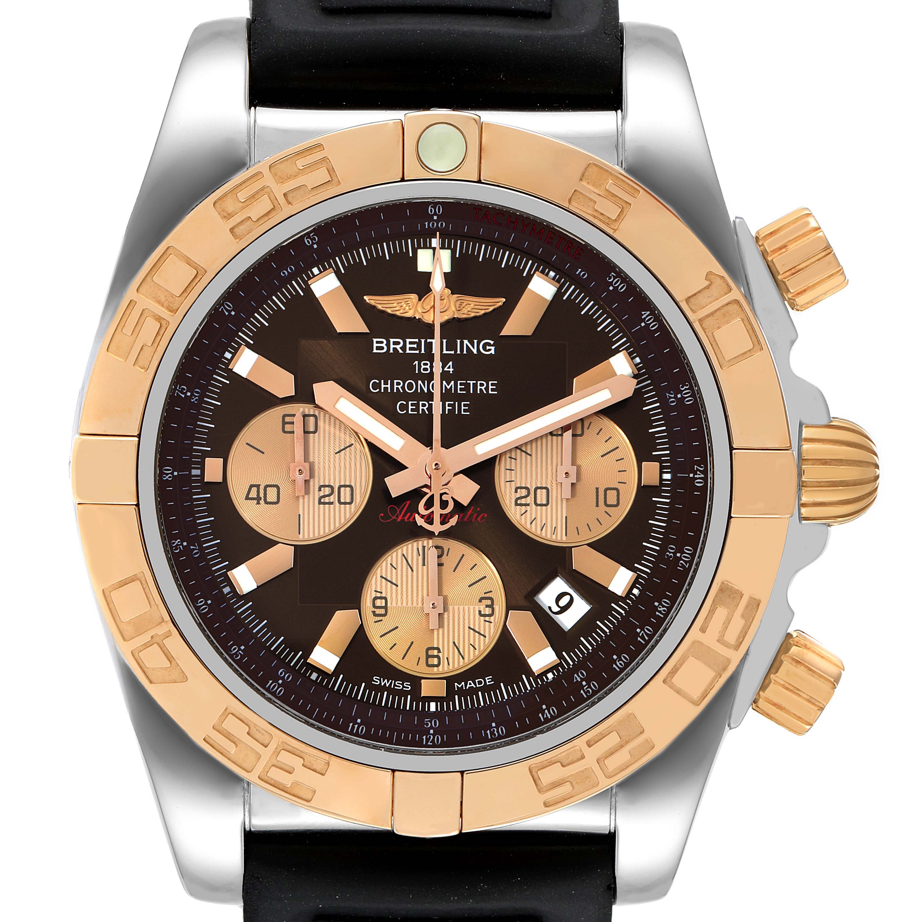 The image shows a frontal view of a Breitling Chronomat CB0110 Men's Steel and Gold (two tone) Brown Dial CB0110 Men's Steel and Gold (two tone) Brown Dial watch, showcasing its dial, bezel, crown, and subdials.
