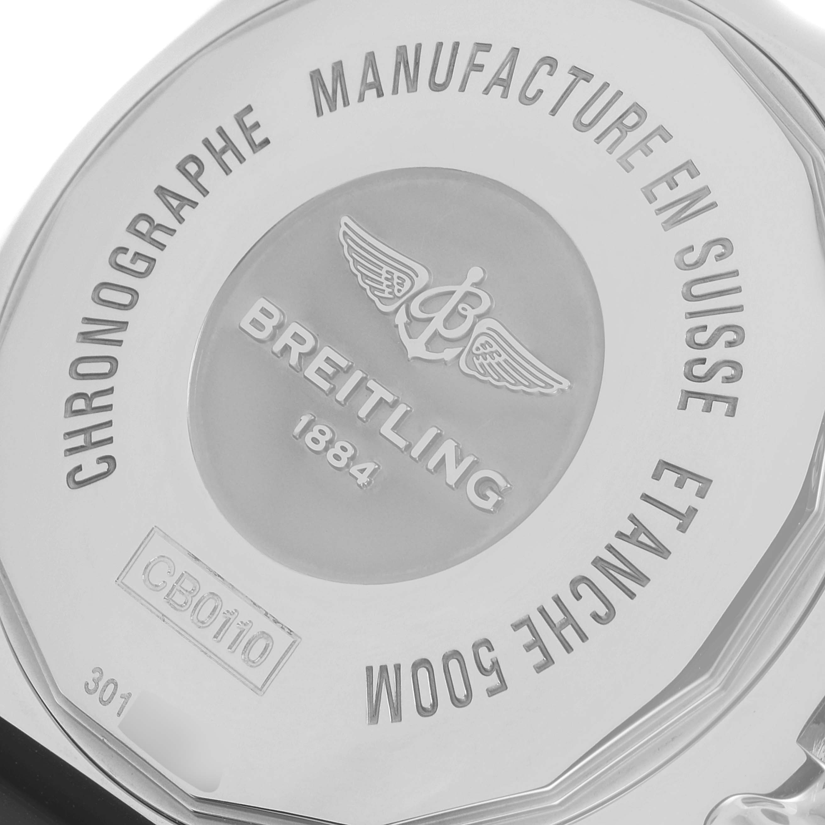This image shows the back case of a Breitling Chronomat CB0110 Men's Steel and Gold (two tone) Brown Dial CB0110 Men's Steel and Gold (two tone) Brown Dial watch, highlighting its engravings and logo.
