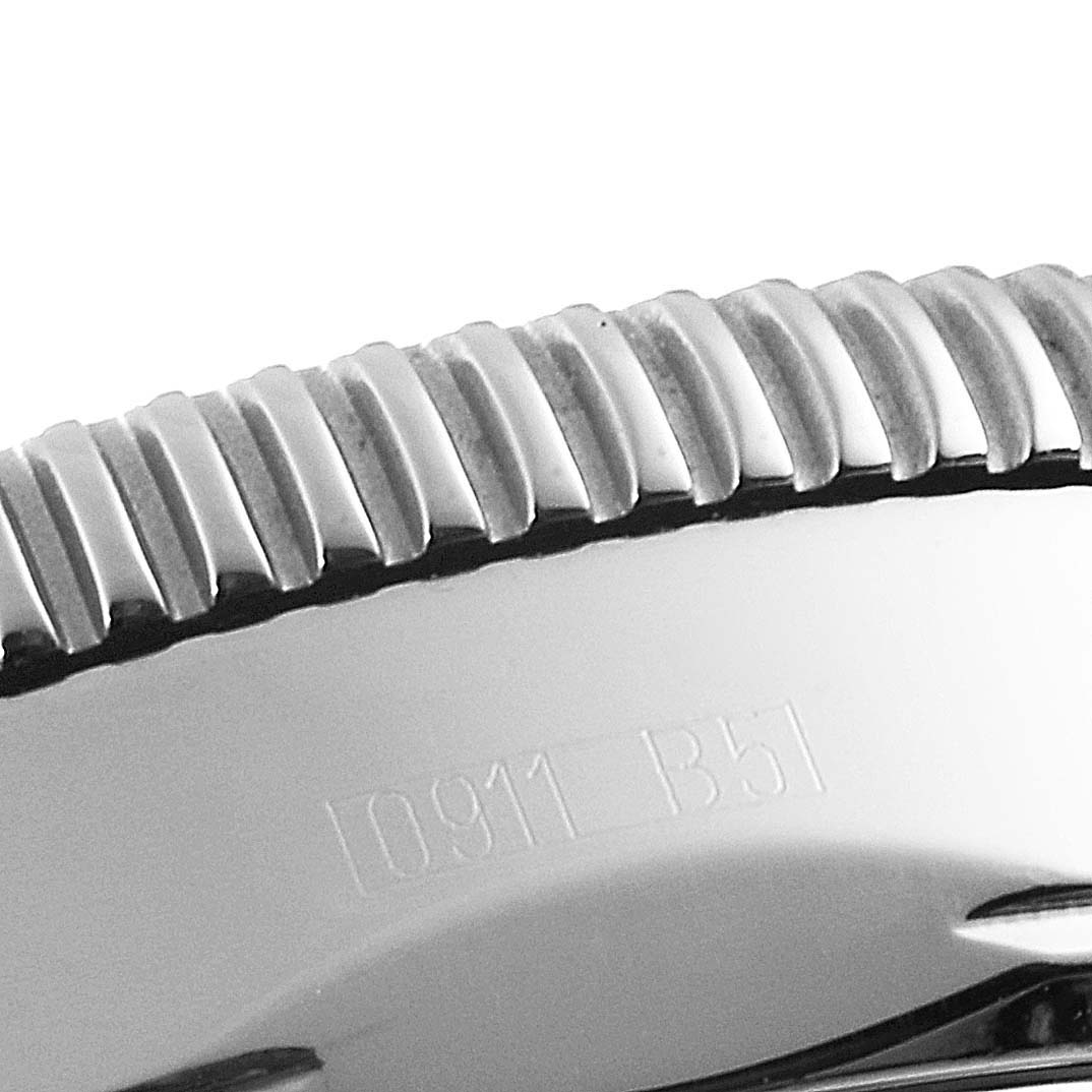 The image shows a close-up side view of the bezel and case of a Breitling Transocean watch.