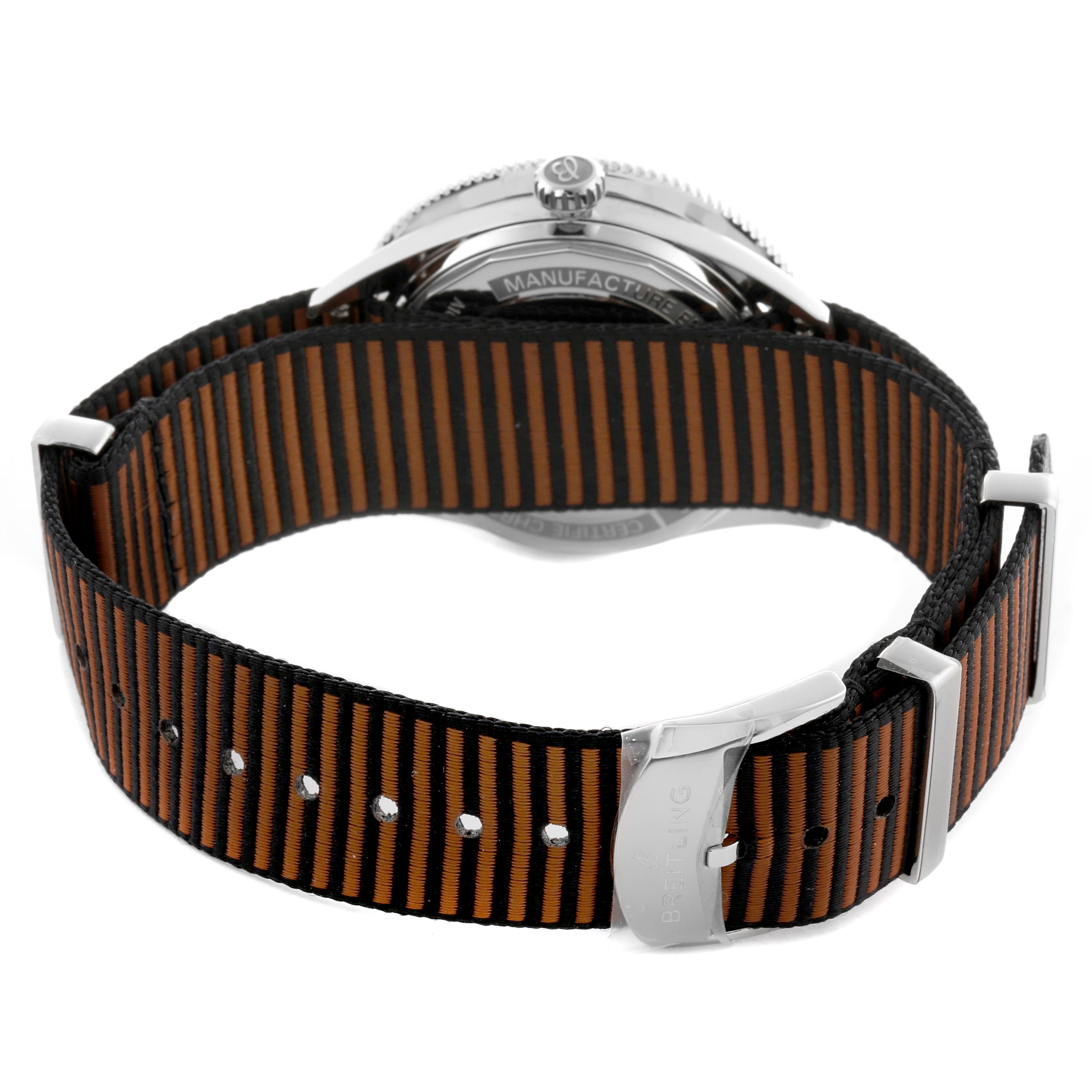 The image shows the Breitling Superocean A10370 Men's Stainless Steel Brown Dial A10370 Men's Stainless Steel Brown Dial watch from the back, highlighting the crown and striped fabric strap.