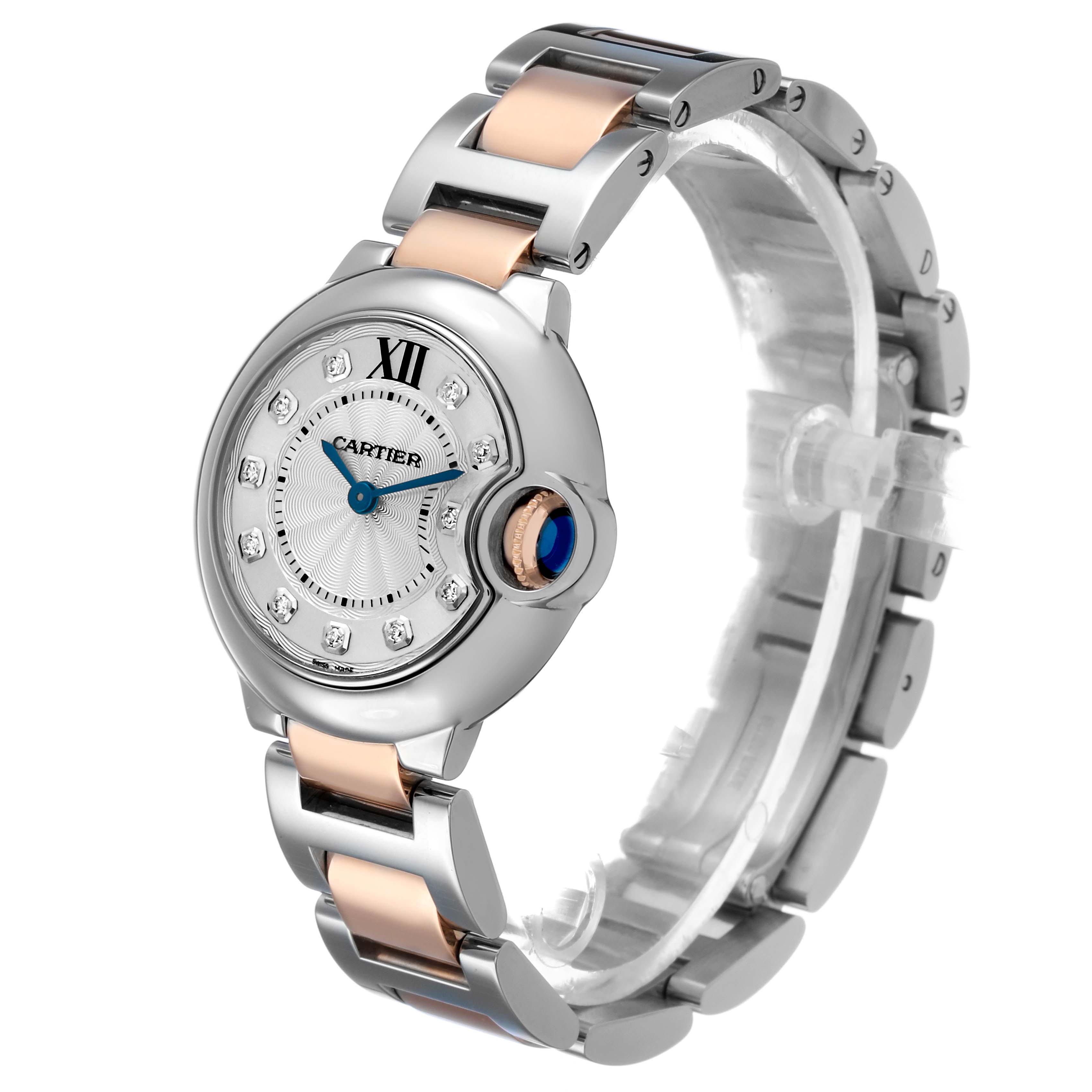 The Cartier Ballon Bleu WE902030 Women's Steel and Gold (two tone) Silver Dial watch is shown at a three-quarter angle, highlighting its face, crown, and two-tone bracelet.
