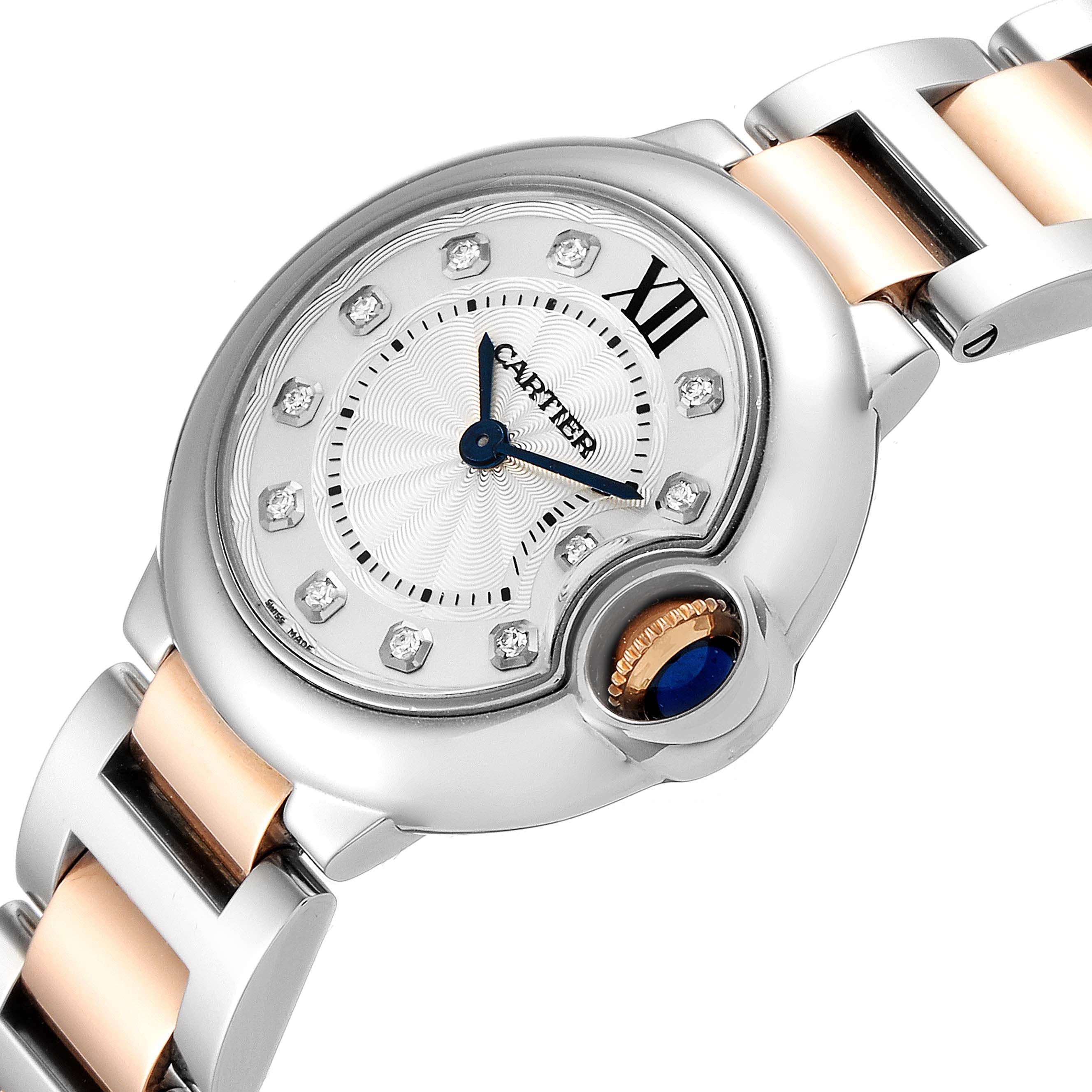 The image shows a close-up of a Cartier Ballon Bleu WE902030 Women's Steel and Gold (two tone) Silver Dial WE902030 Women's Steel and Gold (two tone) Silver Dial watch face and part of the two-tone bracelet.