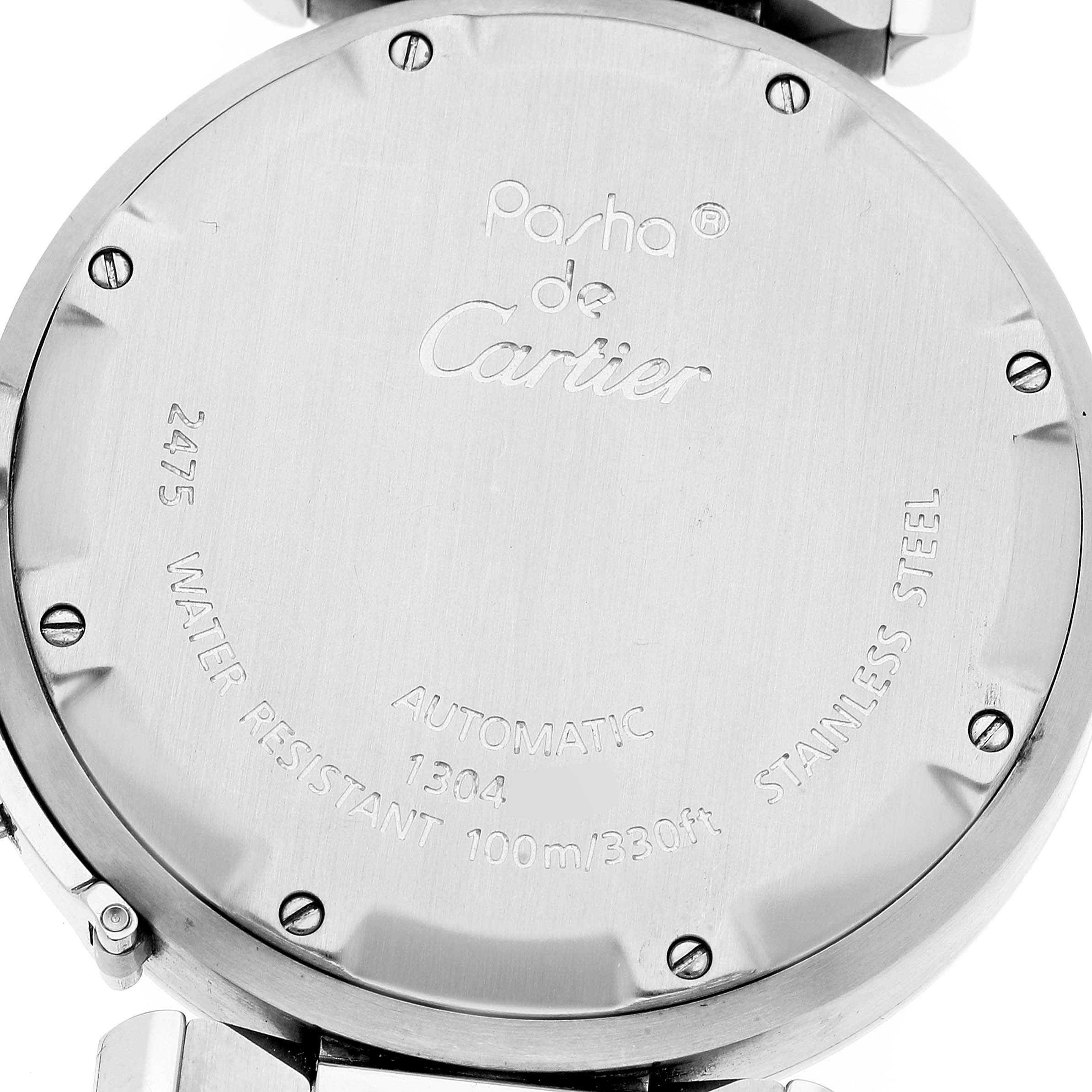 The image shows the back case of a Cartier Pasha W31055M7 Men
s Stainless Steel White Dial W31055M7 Men
s Stainless Steel White Dial watch, displaying engravings and screws.