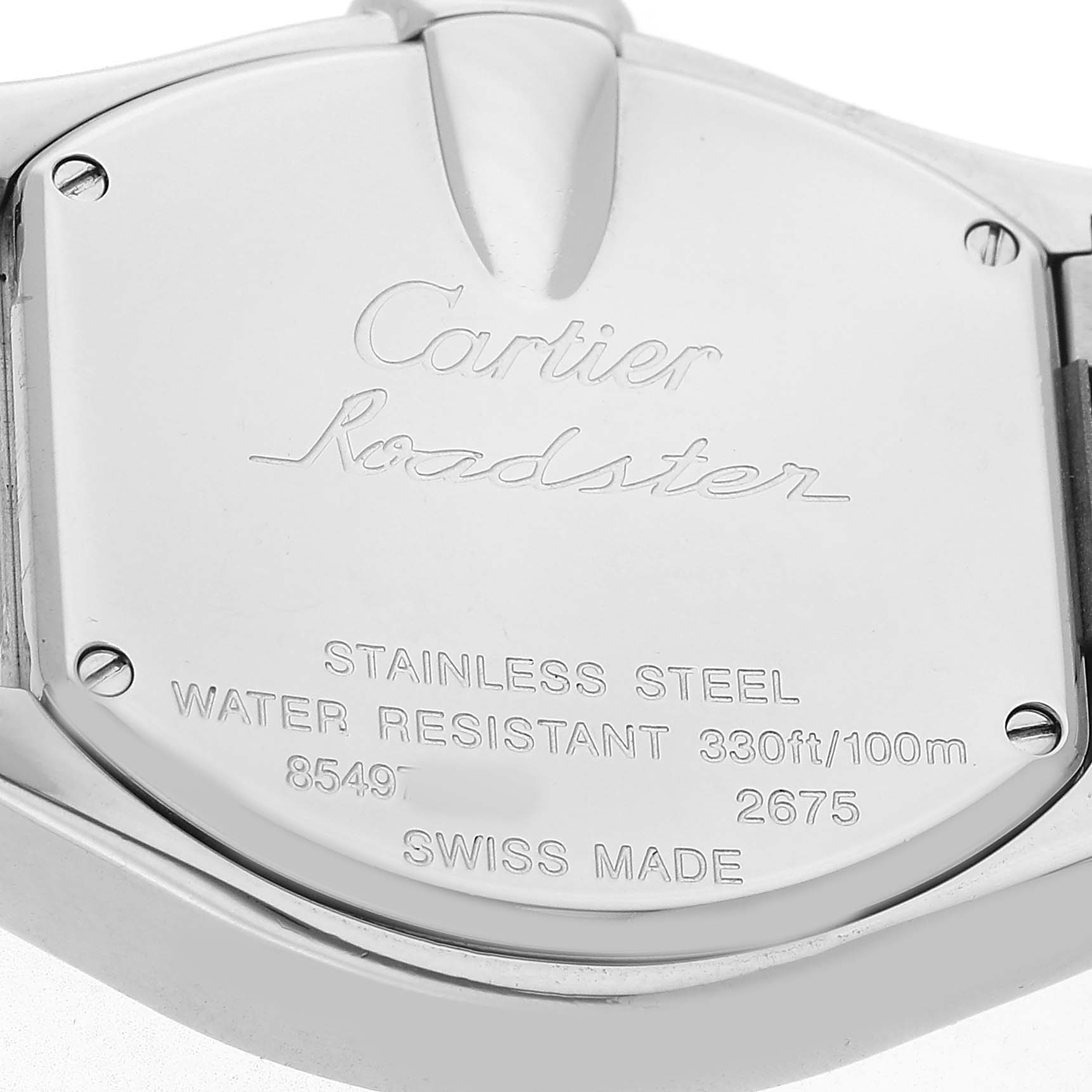The image shows the back of a Cartier Roadster W62017V3 Women's Stainless Steel Pink Dial watch, highlighting the stainless steel case with engravings.