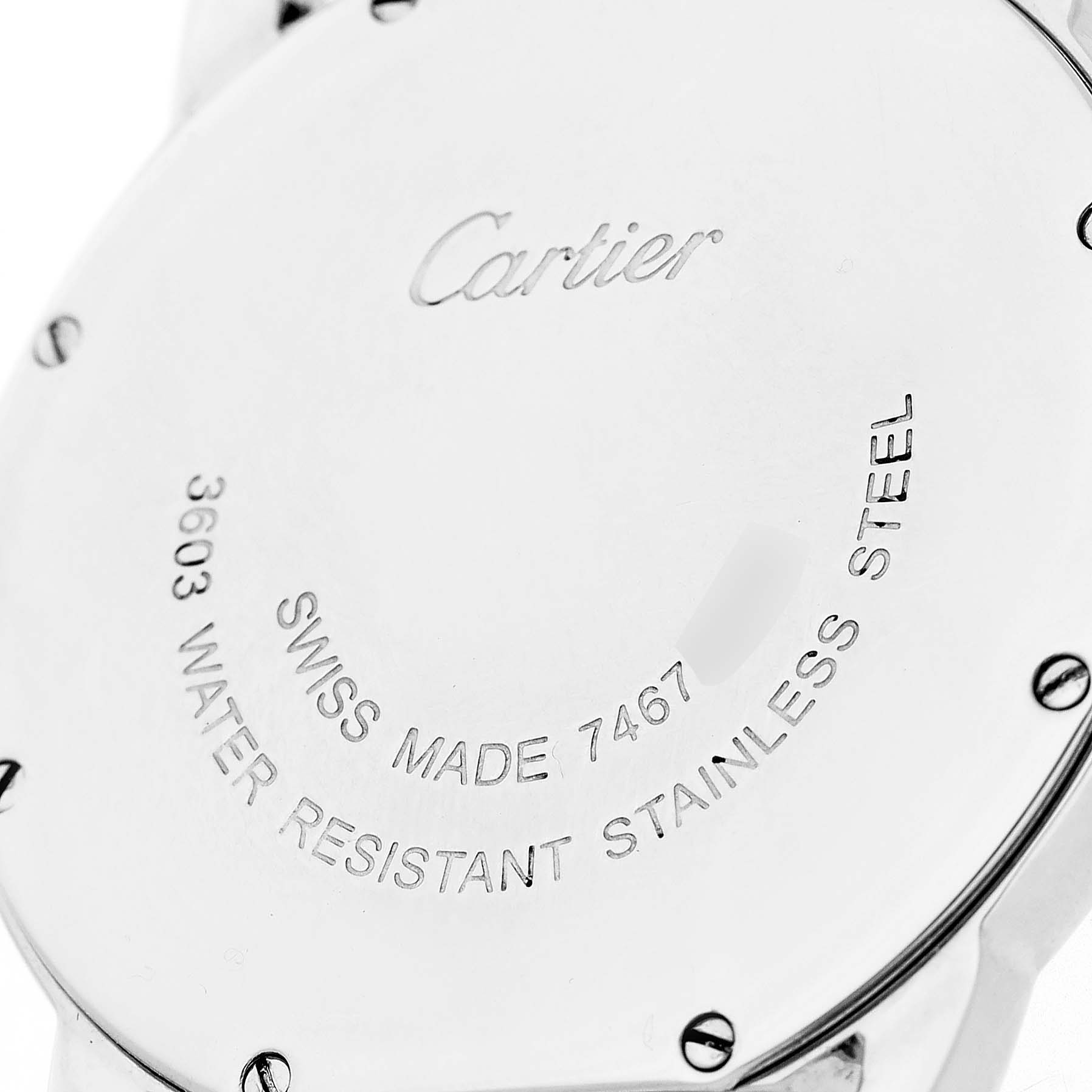 The image shows the back case of a Cartier Ronde W6701005 Men's Stainless Steel Silver Dial watch with engravings indicating model and material details.